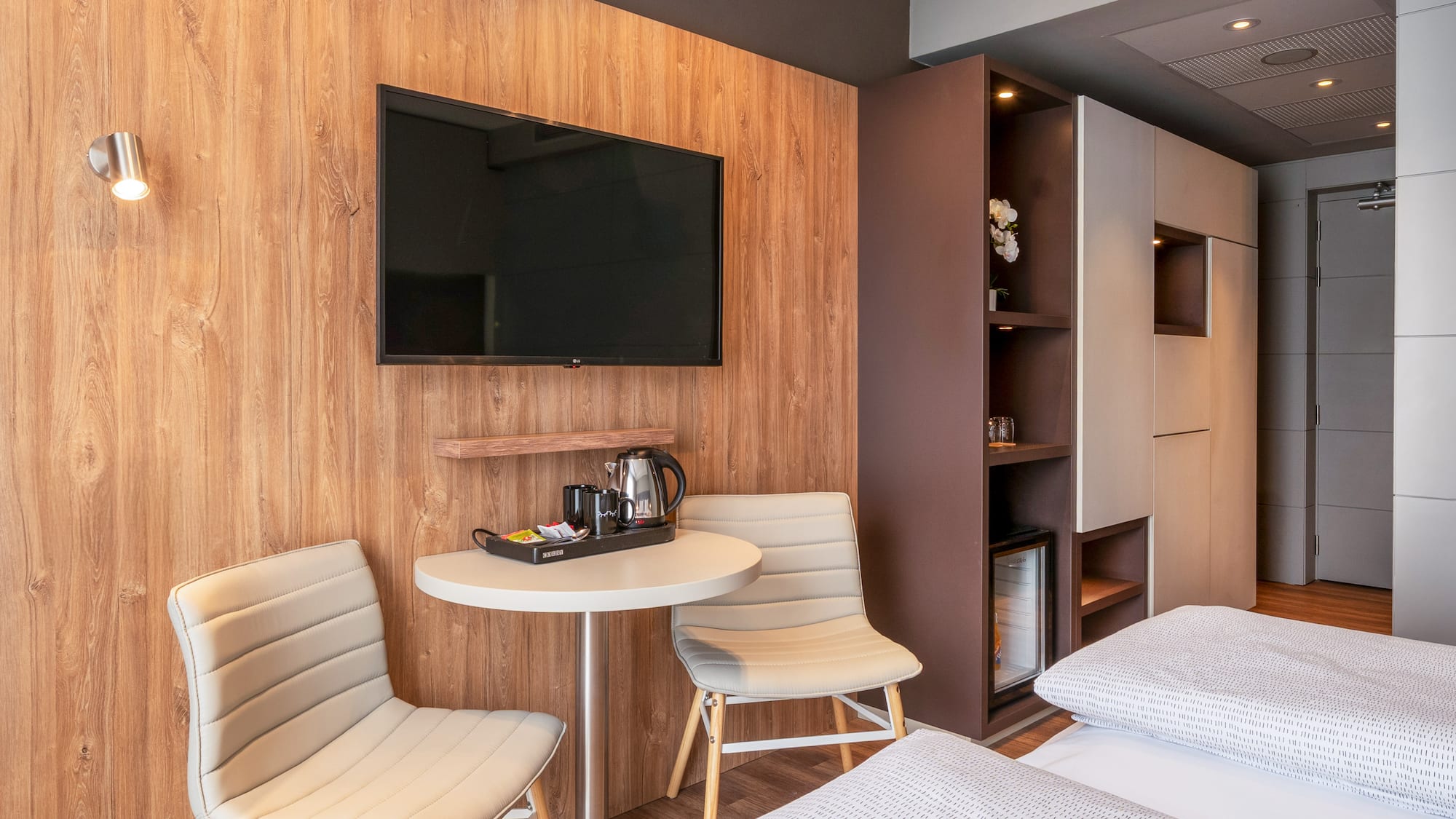 a room with a tv and a table