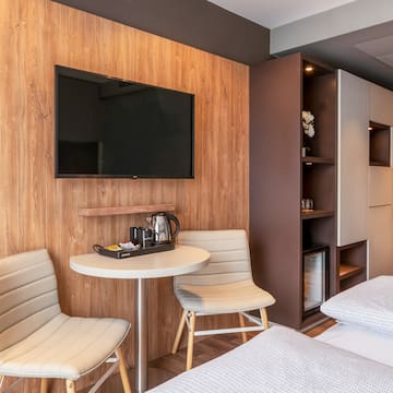 a room with a tv and a table