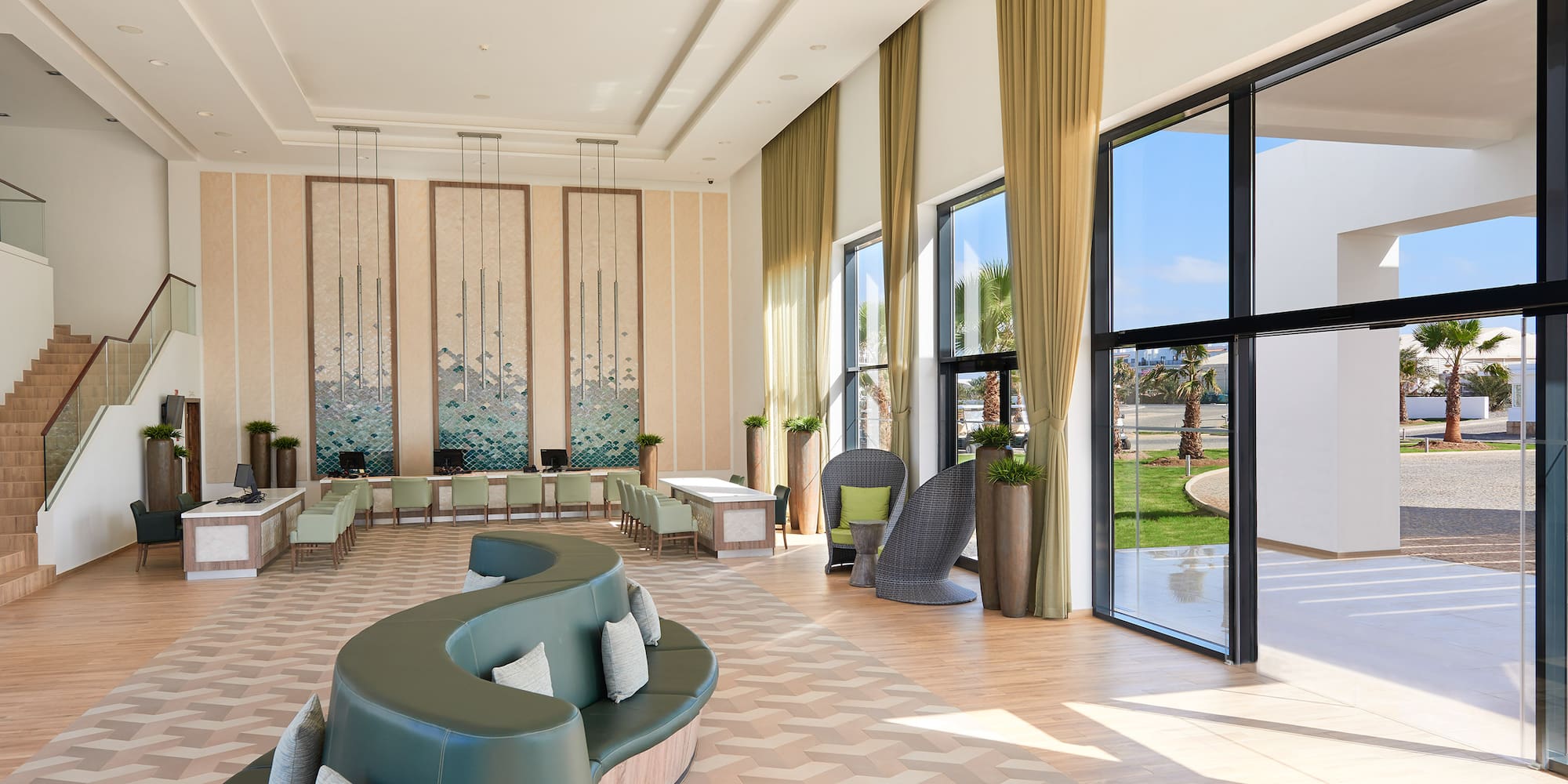 a room with a large couch and chairs