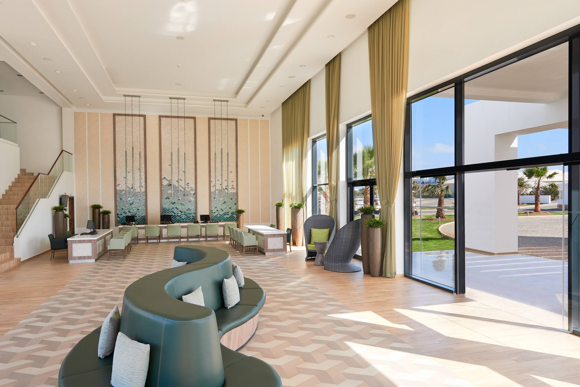 a room with a large couch and chairs