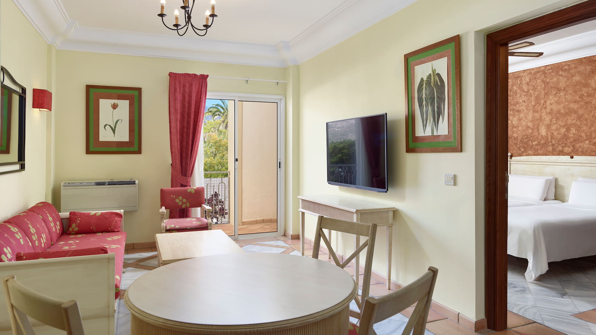 a living room with a table and chairs