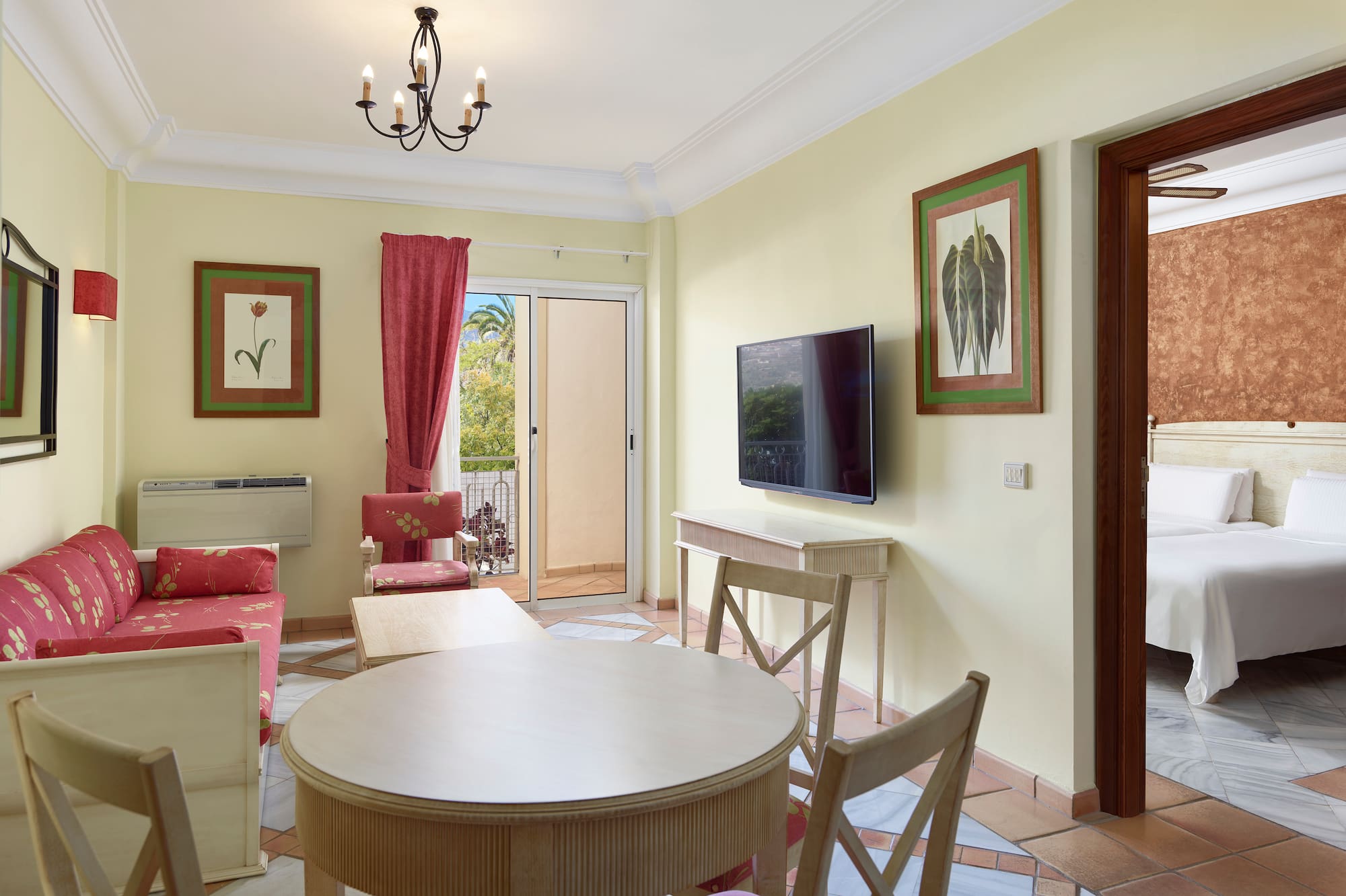 a living room with a table and chairs