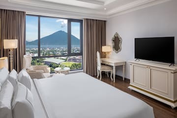 a room with a television and a mountain in the background