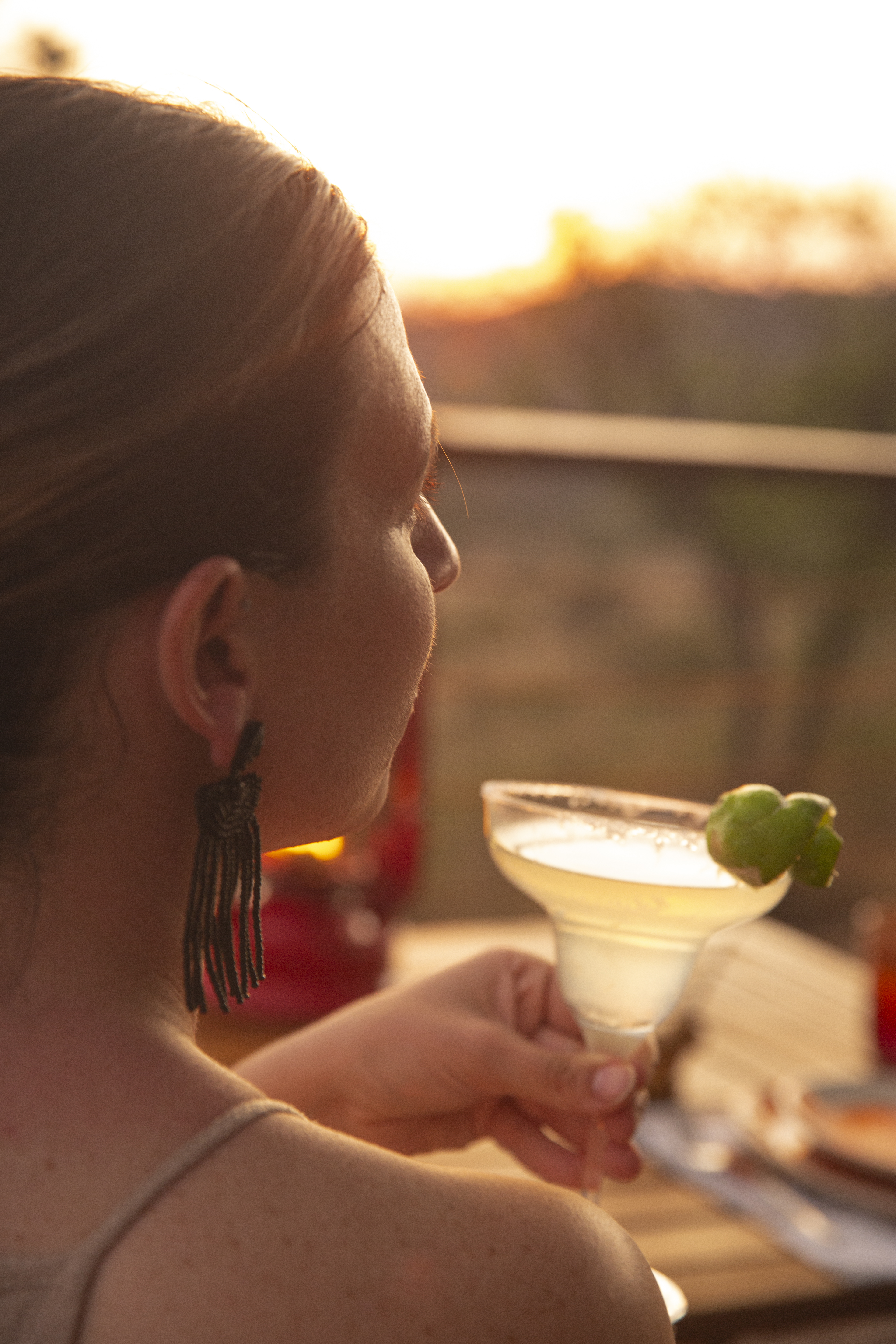 a woman holding a drink