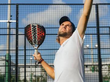 a man holding a tennis racket