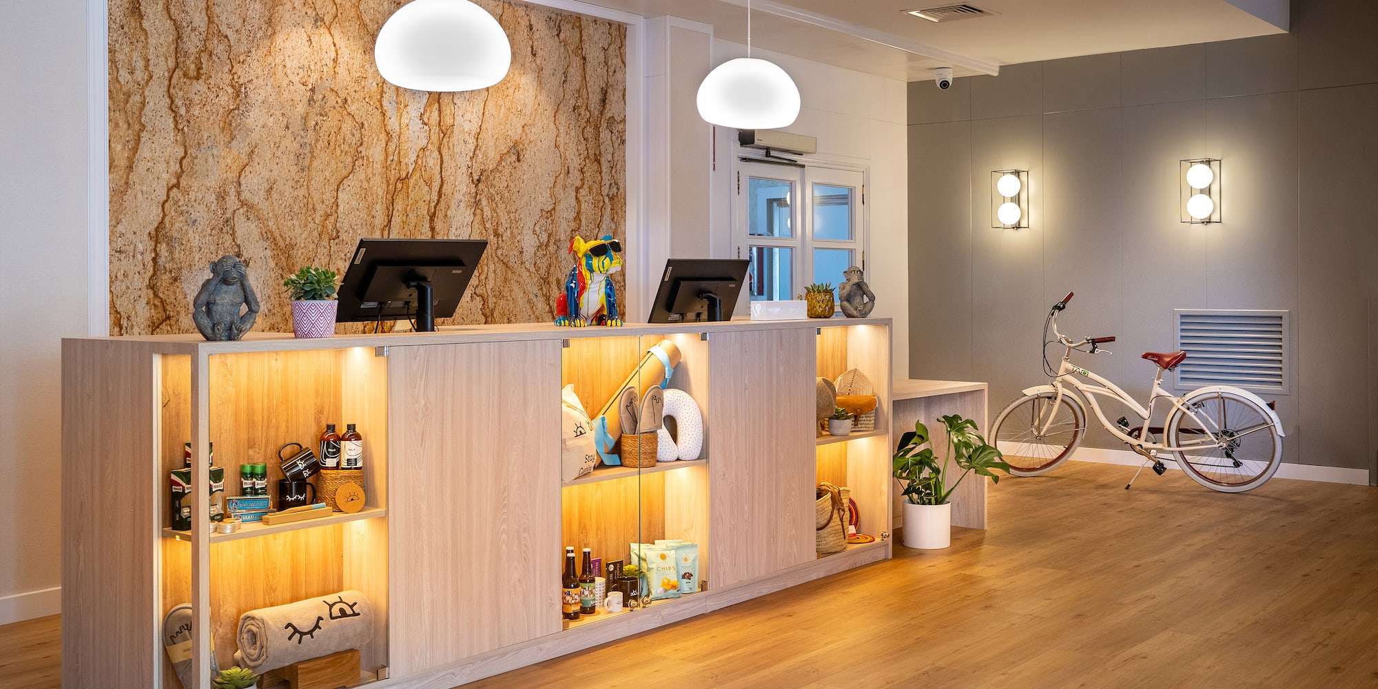a reception desk with shelves and a bicycle