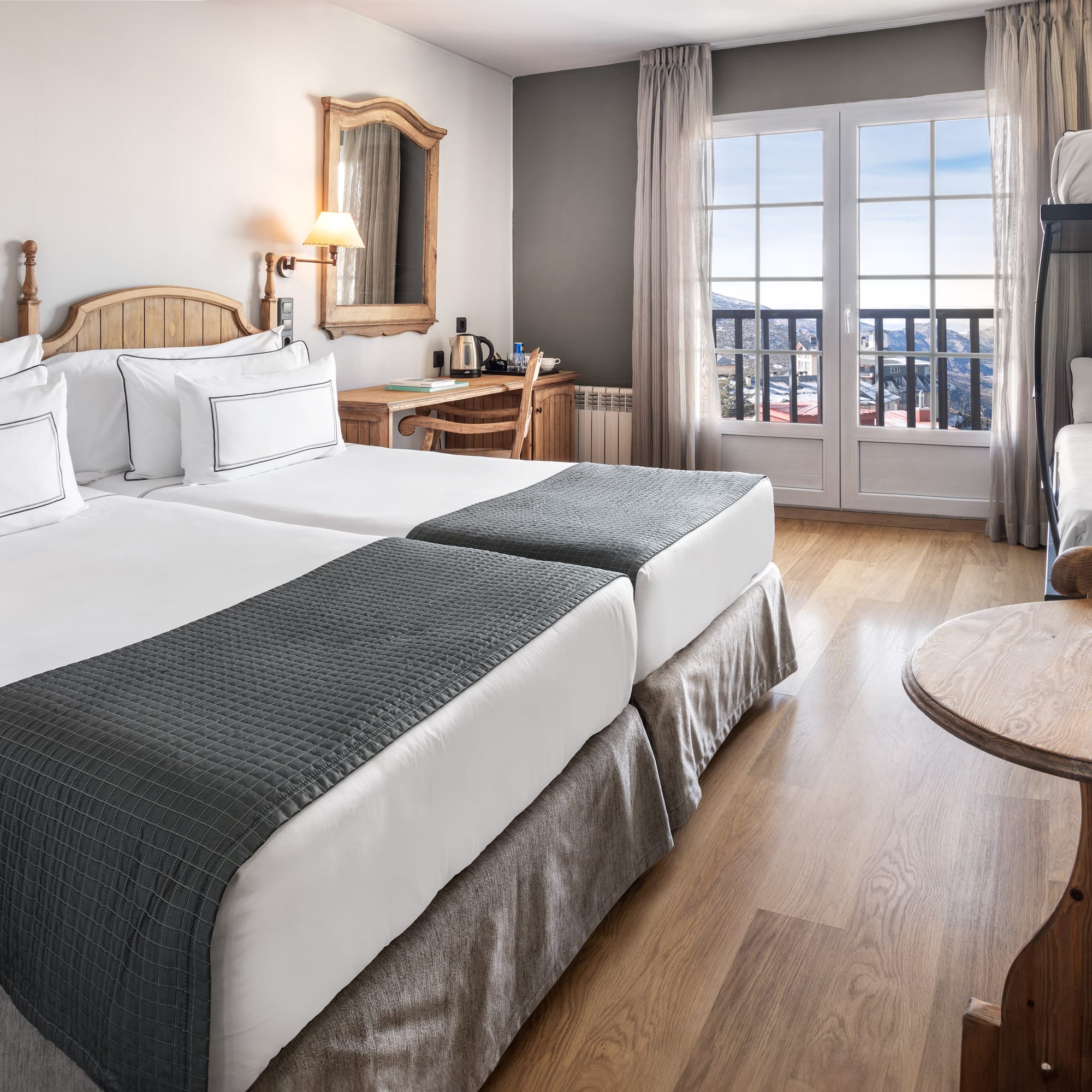 a room with two beds and a bunk bed