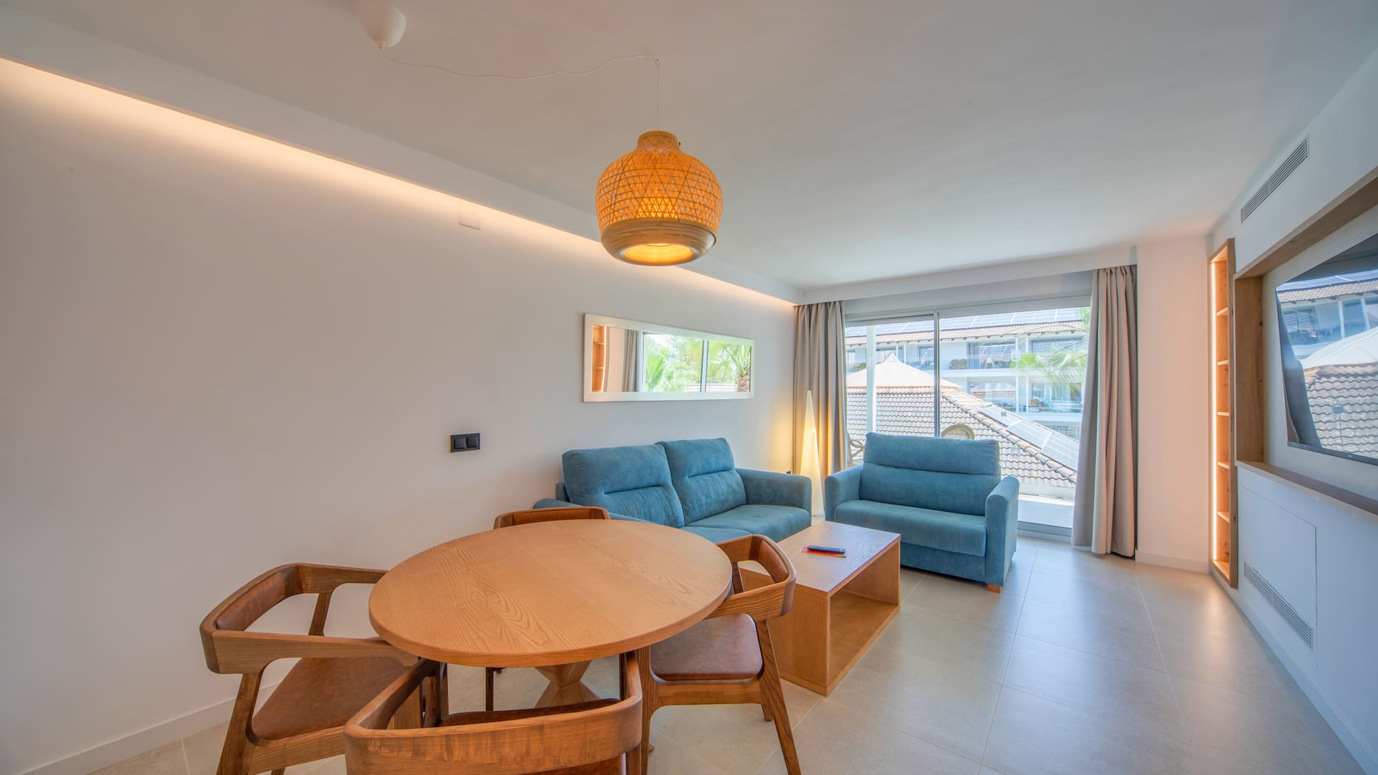 a living room with a table and chairs