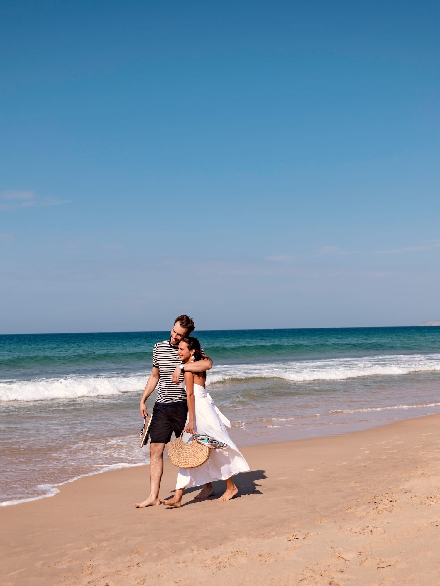 a man and woman on a beach