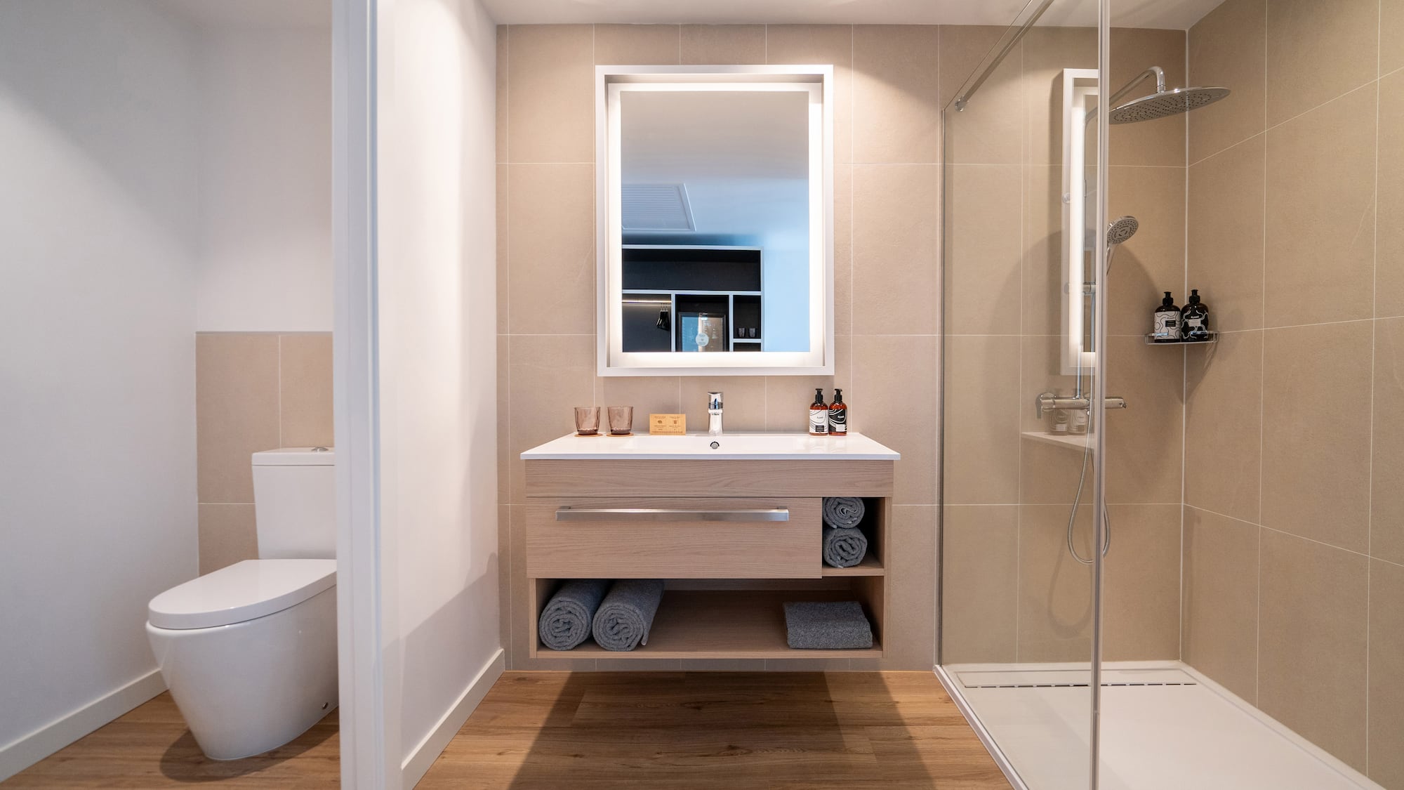 a bathroom with a mirror and a shower