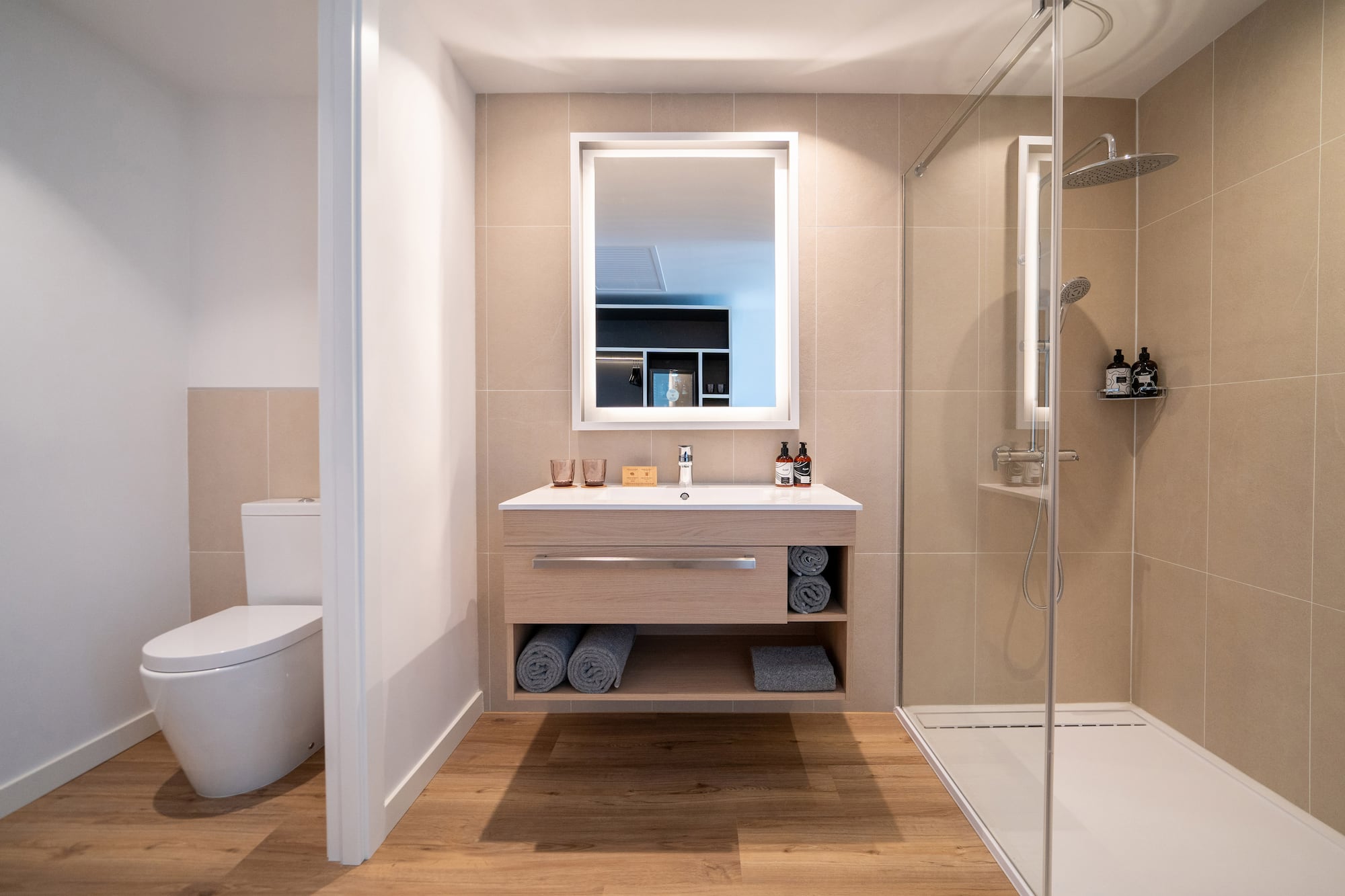 a bathroom with a mirror and a shower