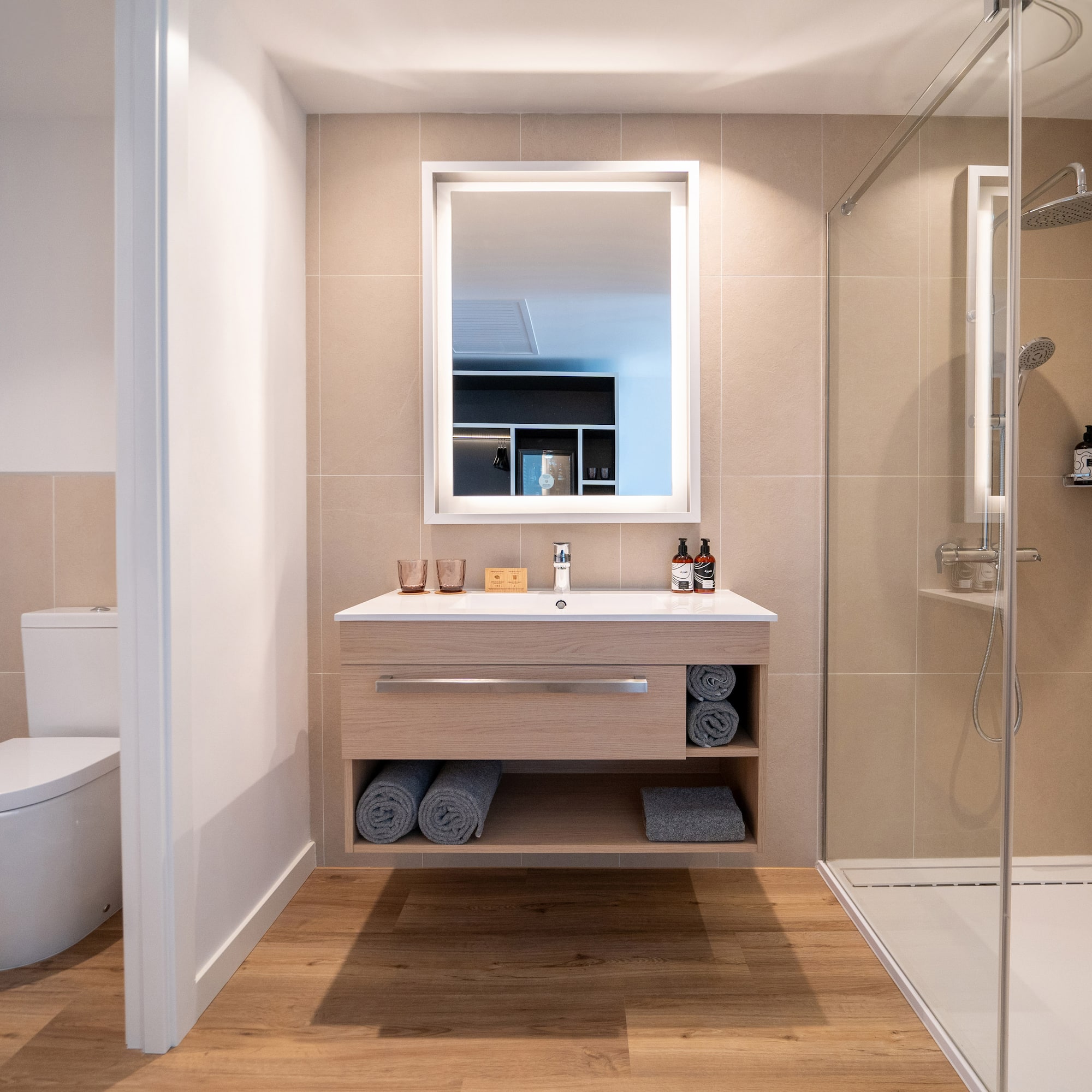 a bathroom with a mirror and a shower
