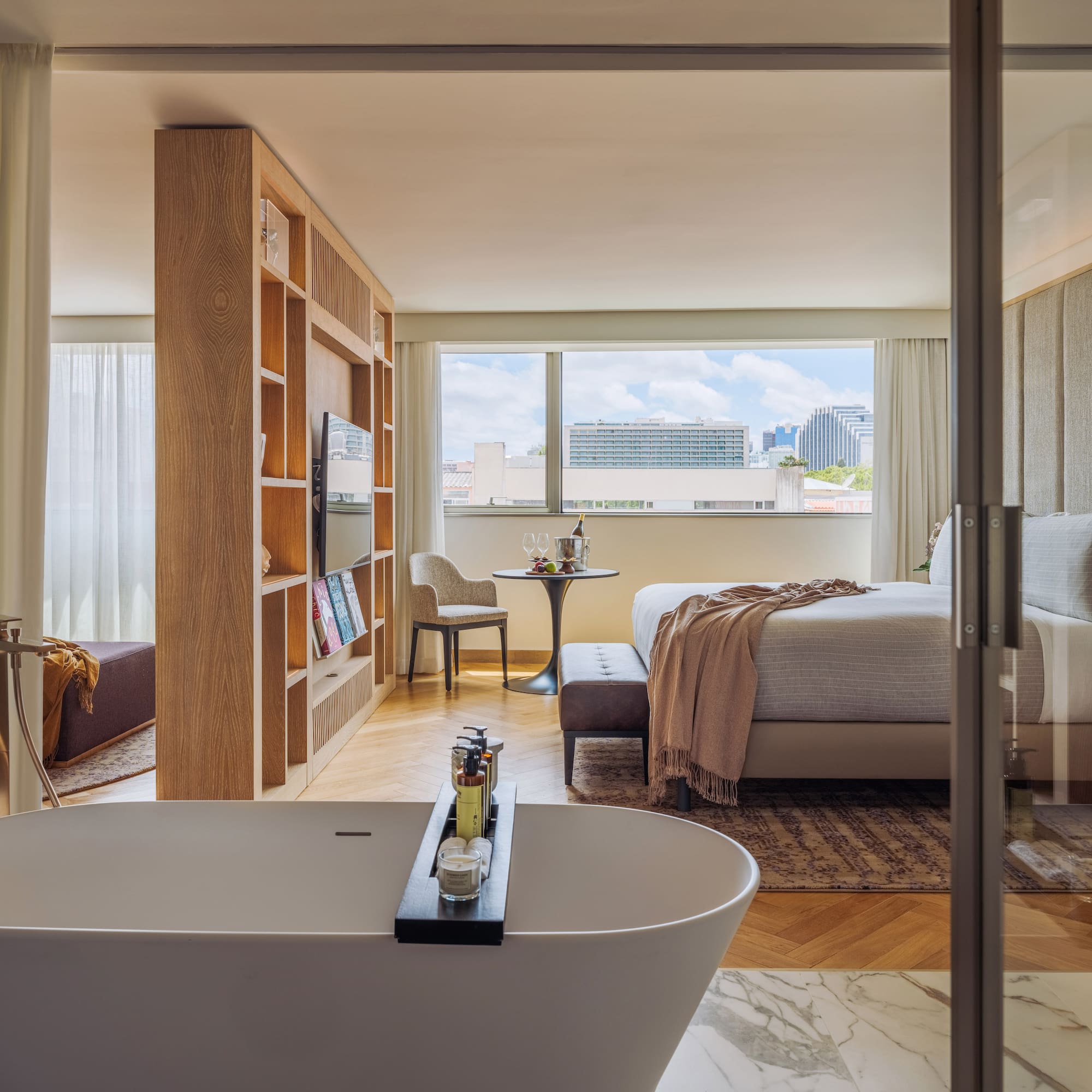 a room with a bed and a bathtub