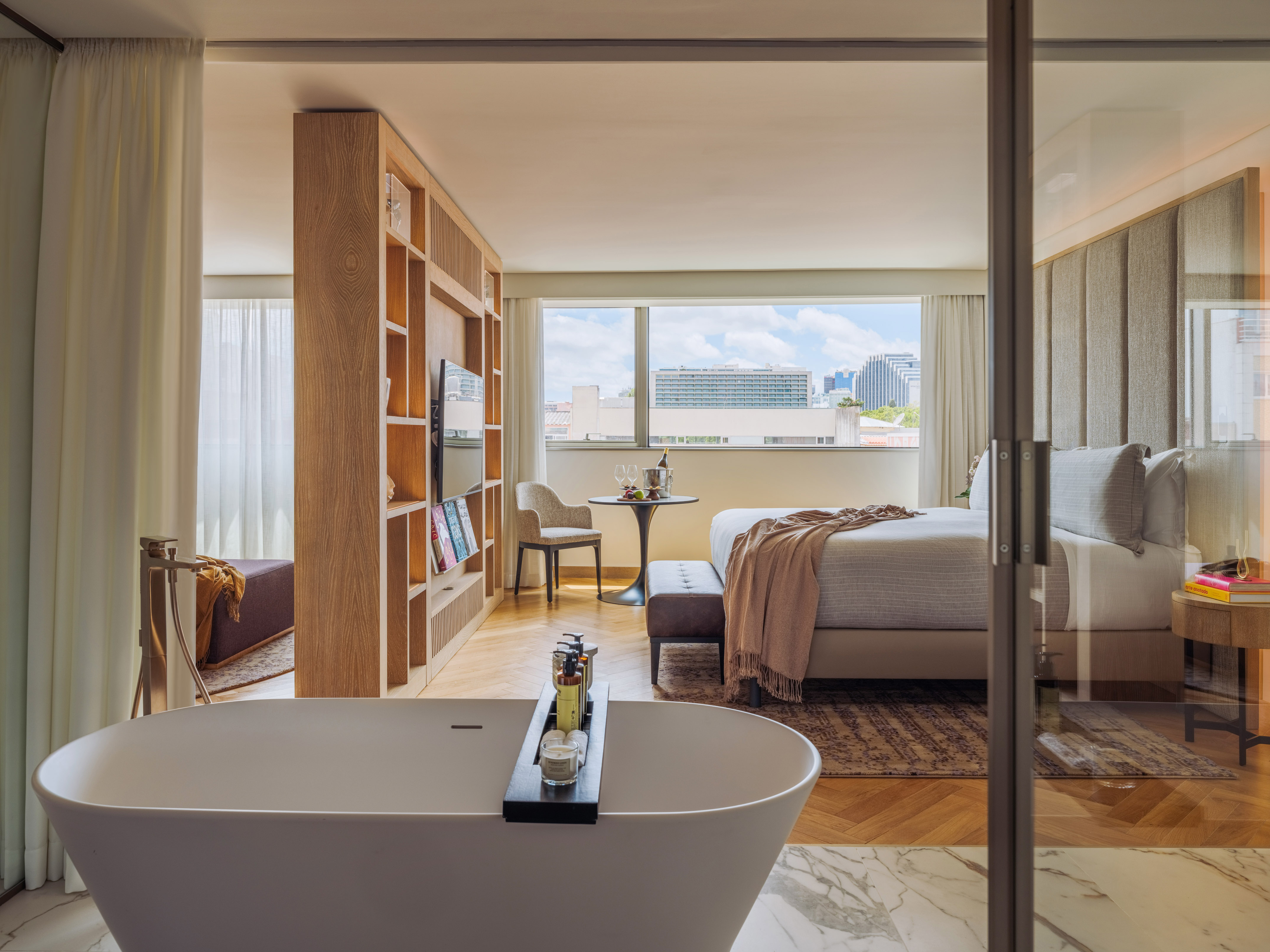 a room with a bed and a bathtub