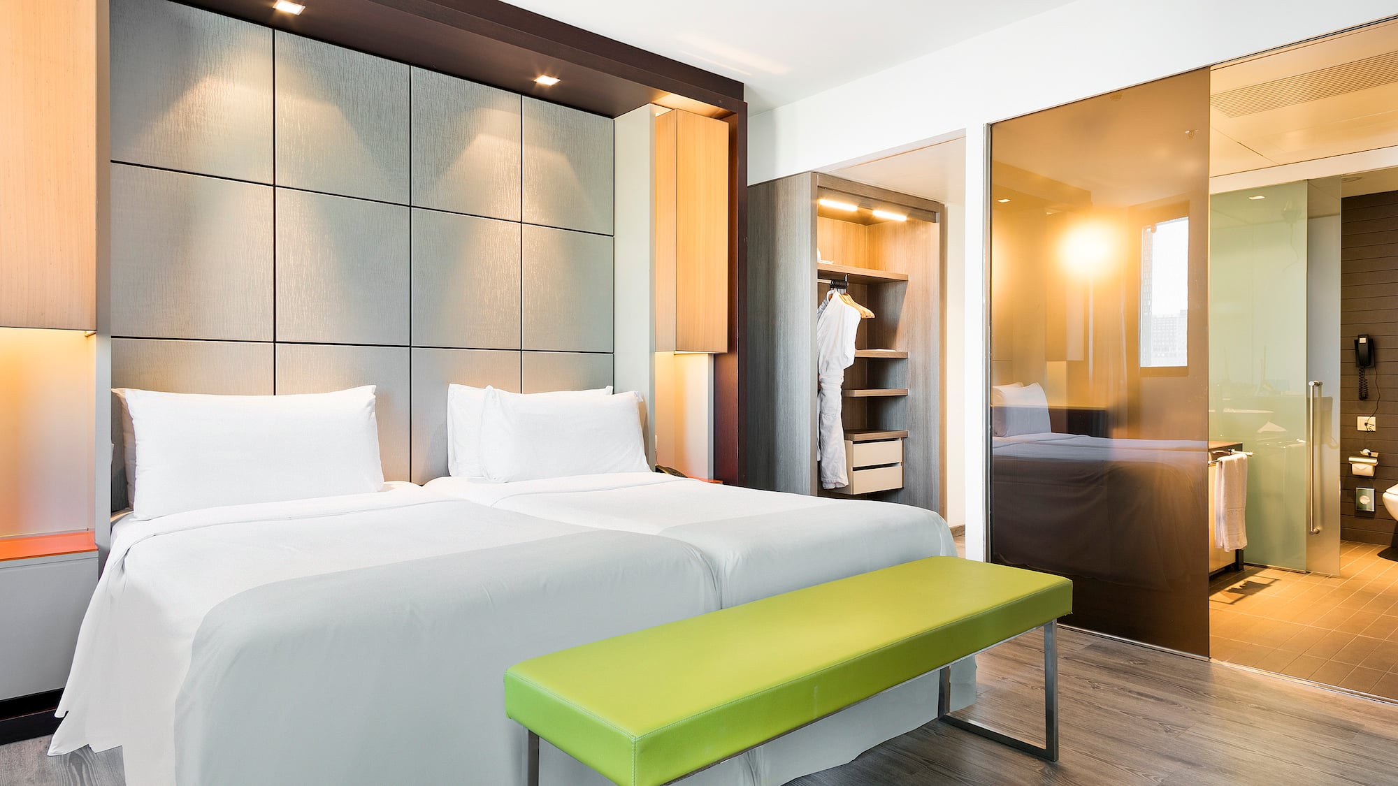 a room with a bed and a bench