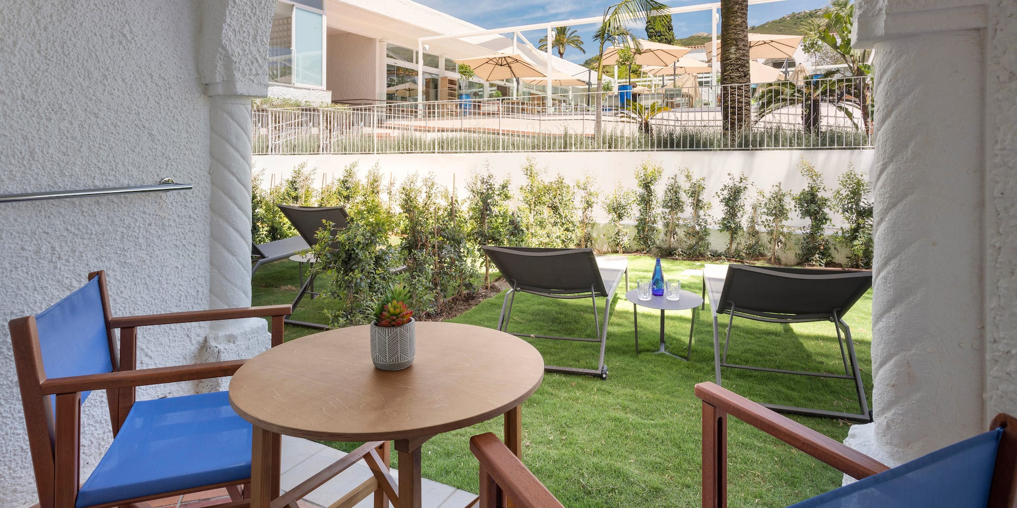 a patio with chairs and tables