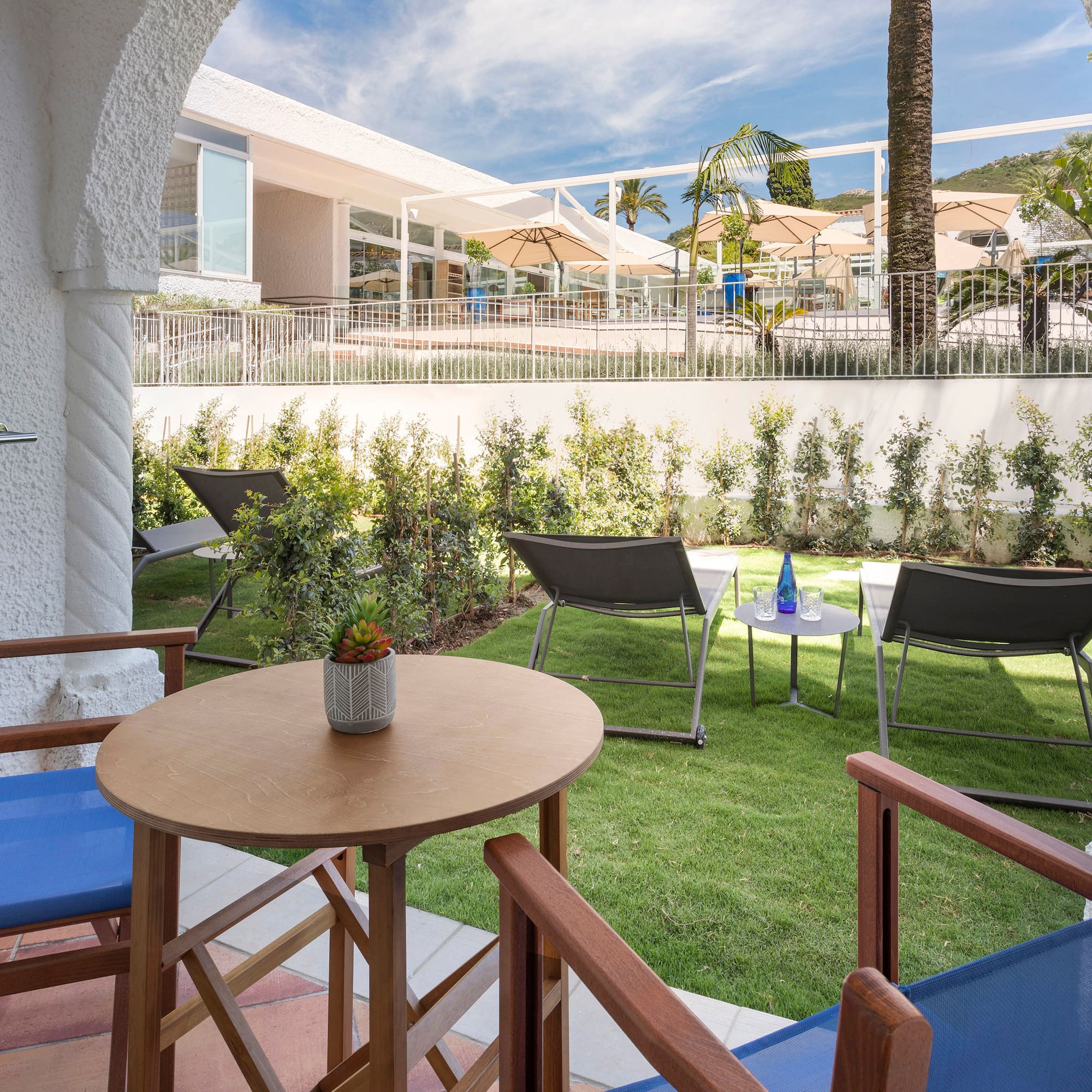 a patio with chairs and tables