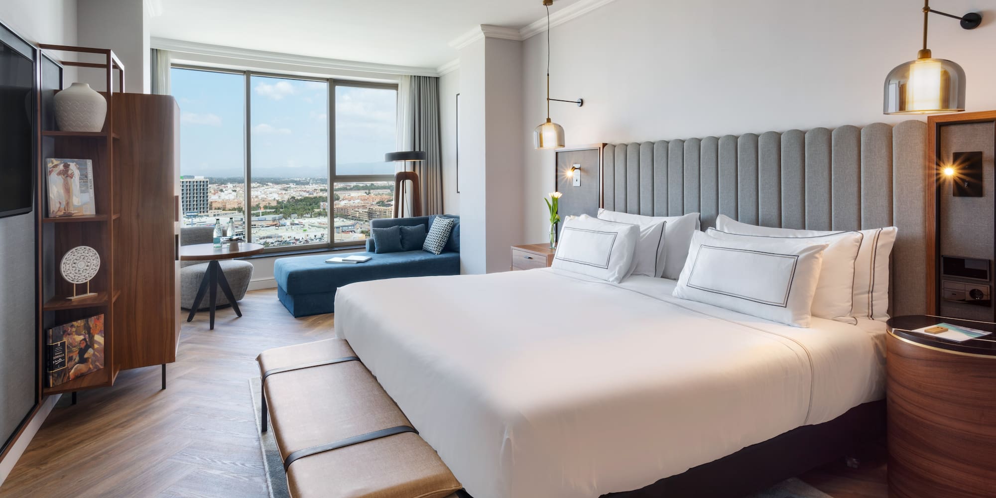 a bedroom with a large bed and a large window