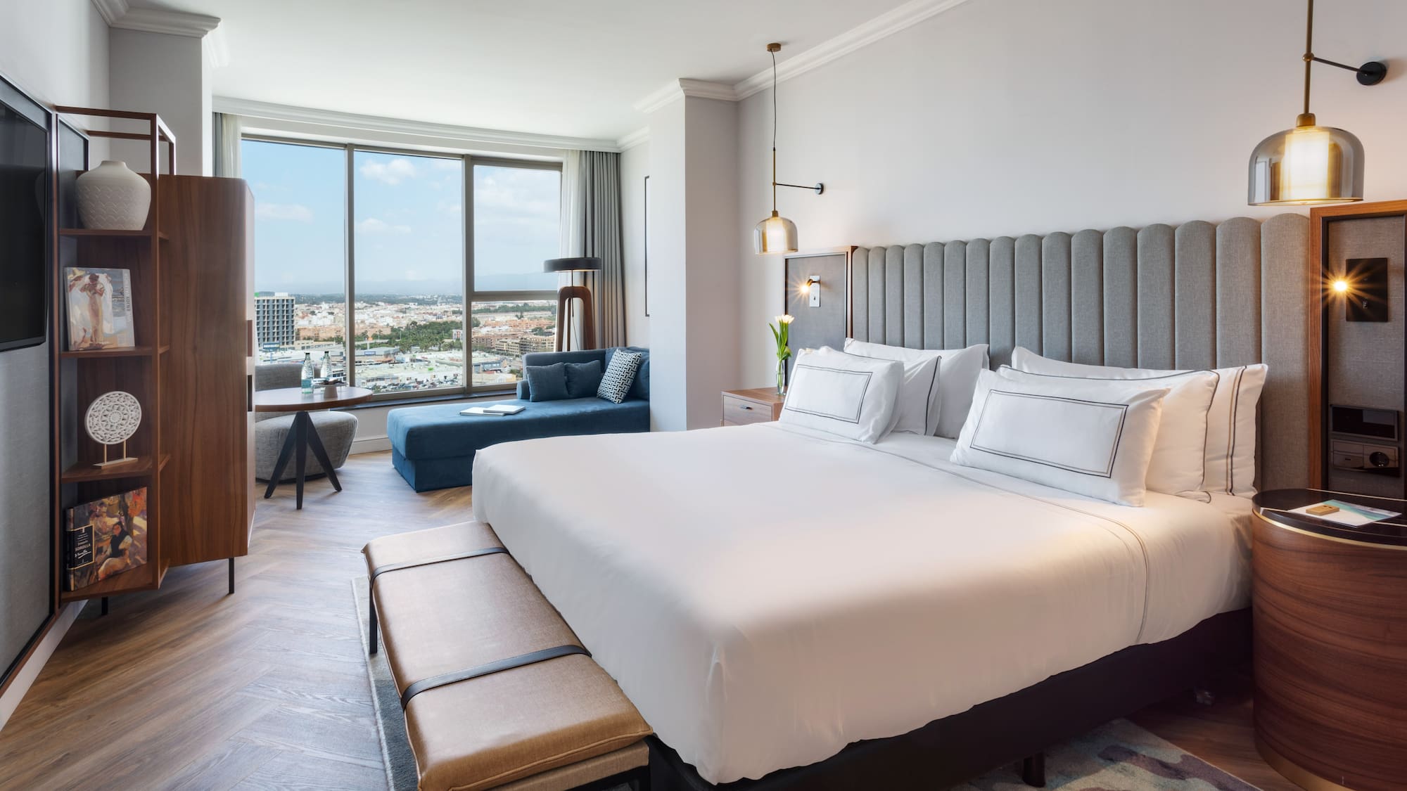 a bedroom with a large bed and a large window