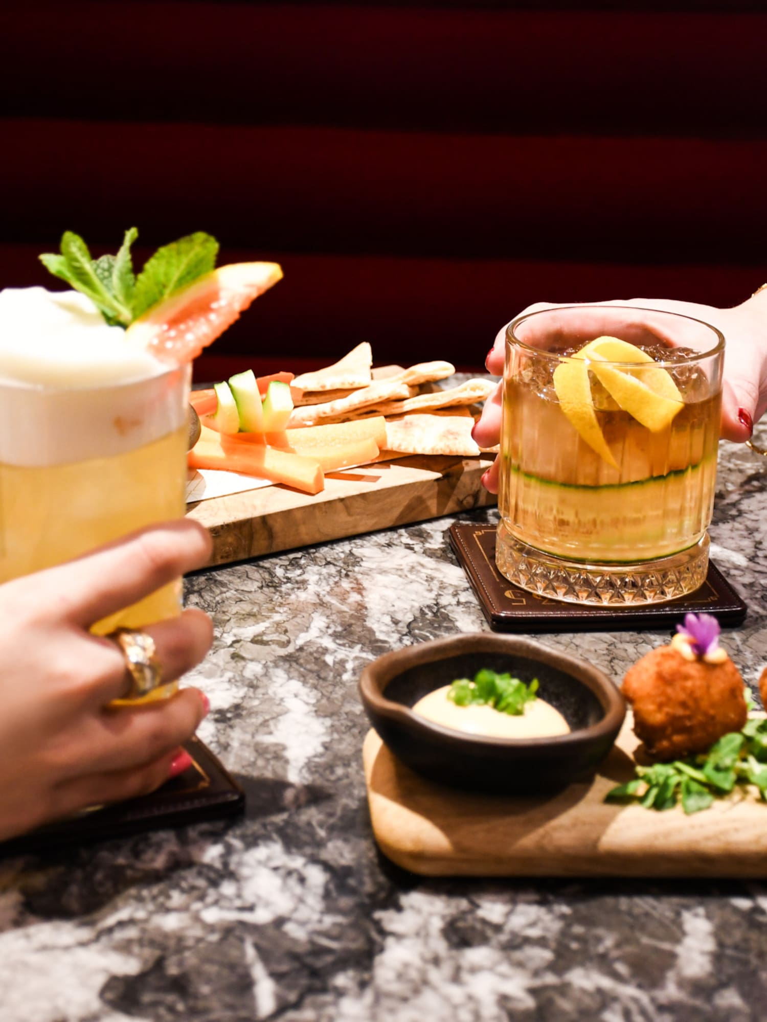 a group of people holding drinks