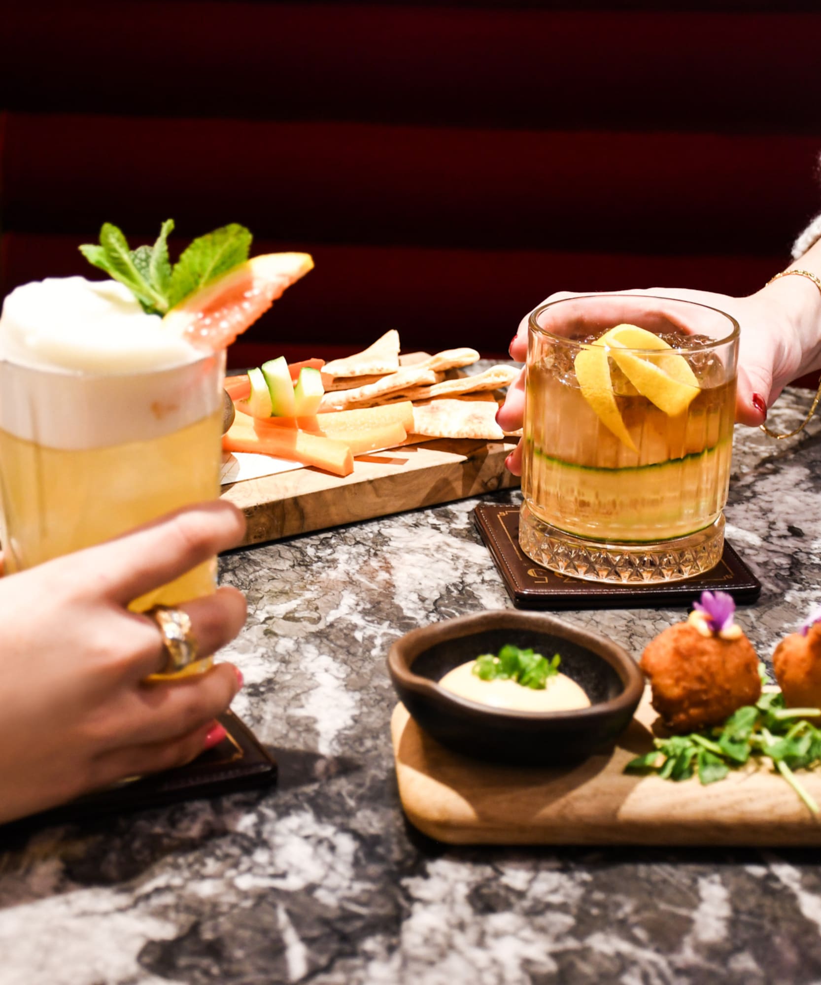 a group of people holding drinks