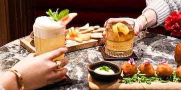 a group of people holding drinks