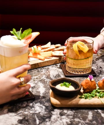 a group of people holding drinks