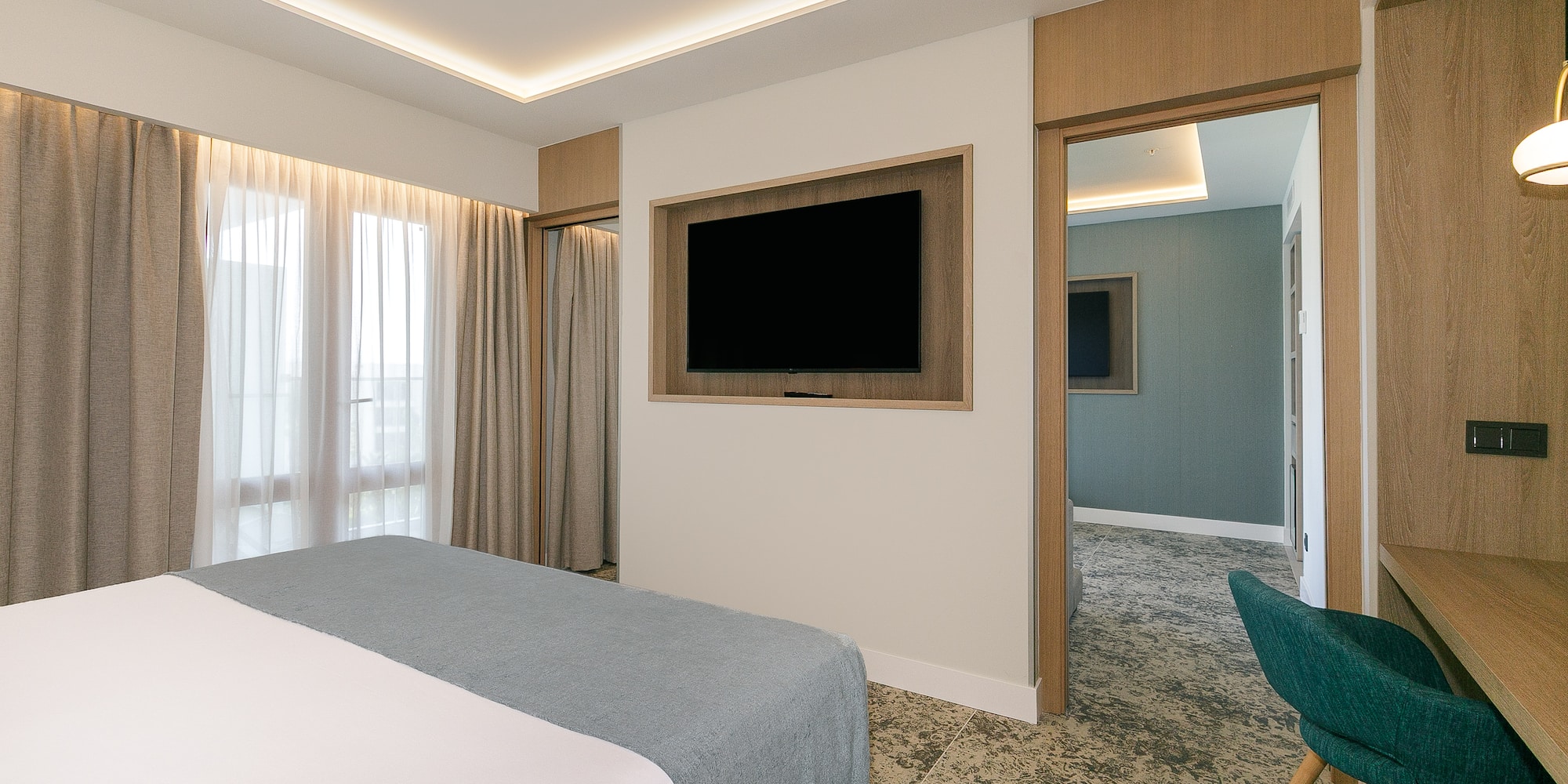 a room with a bed and a tv