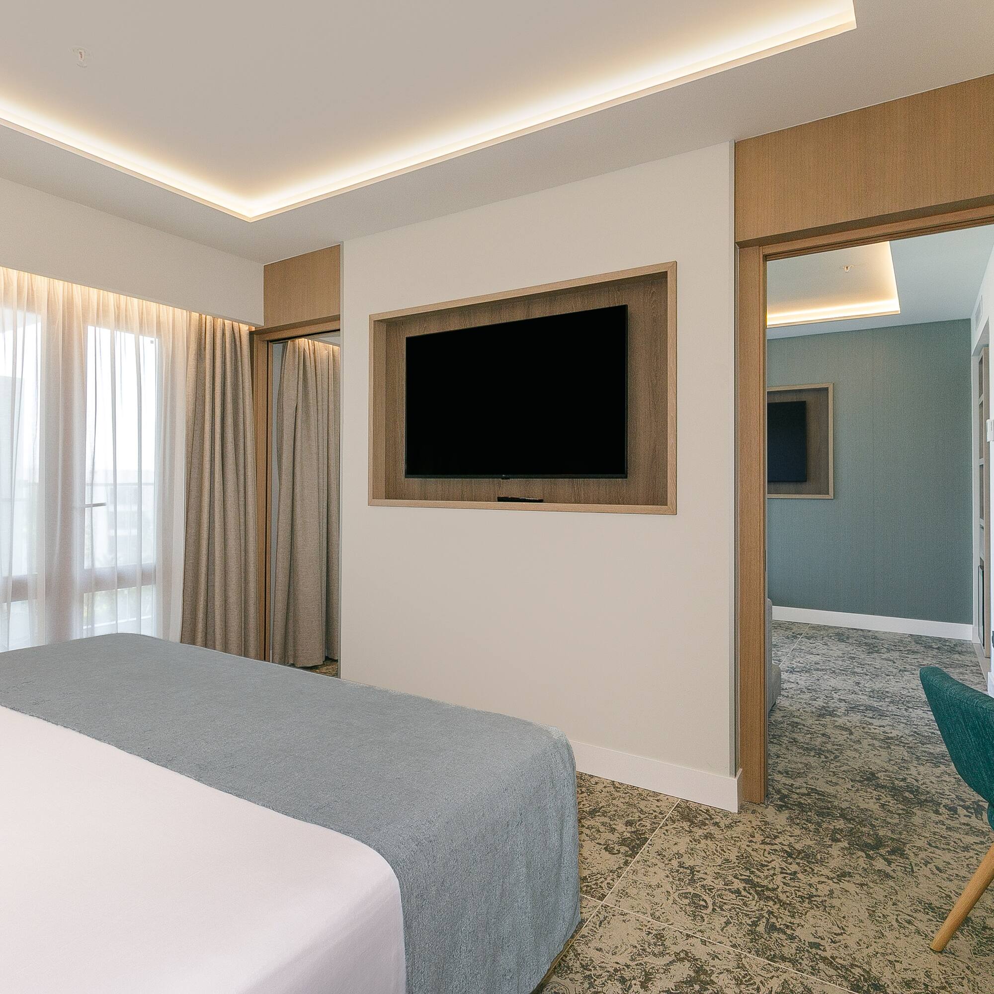 a room with a bed and a tv