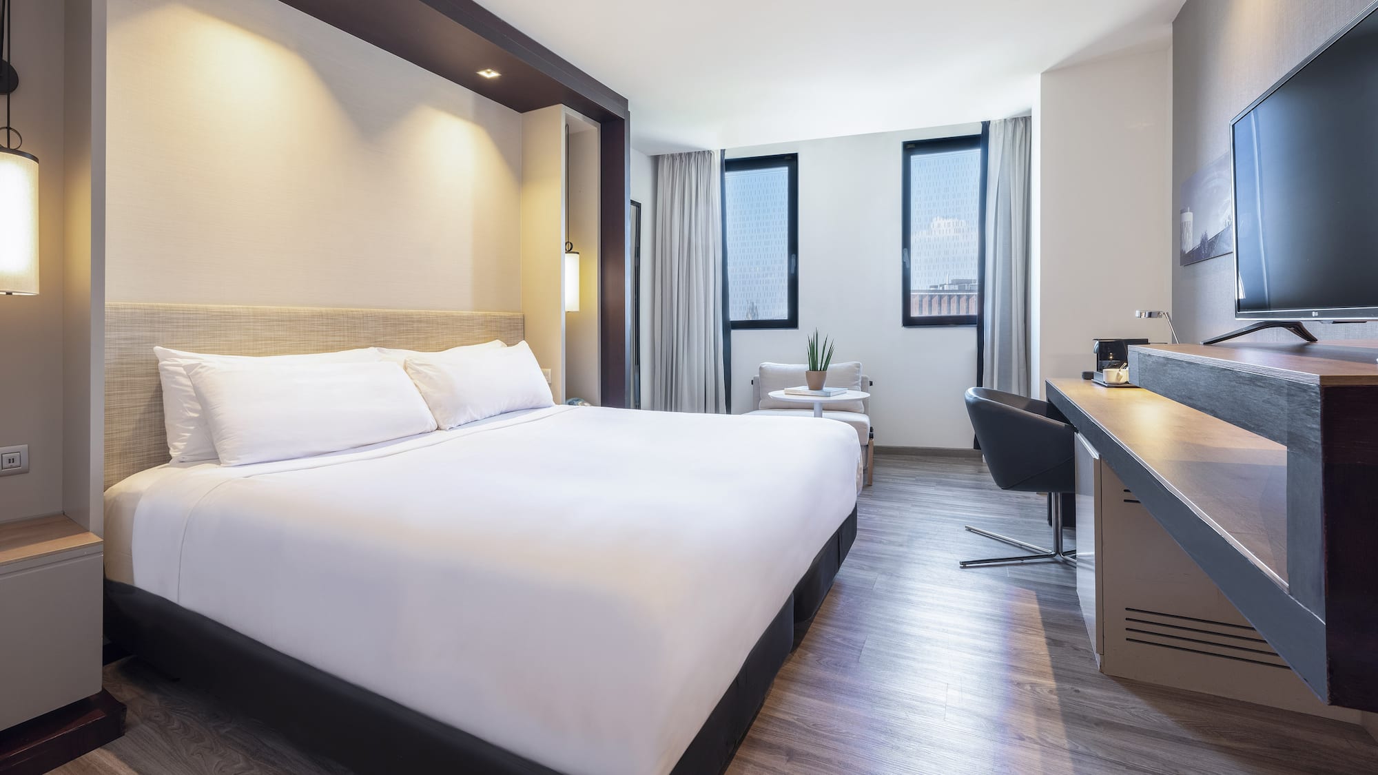 a room with a bed and a desk