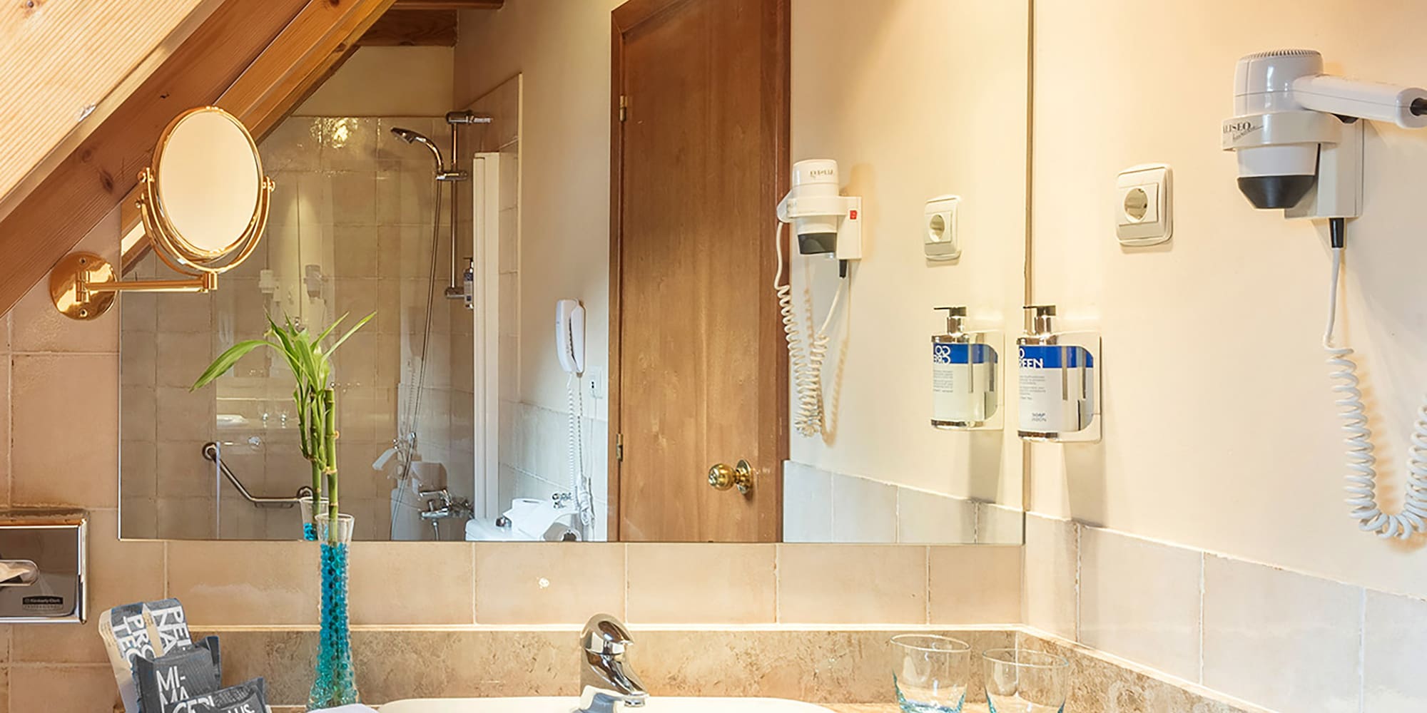 a bathroom with a sink and mirror