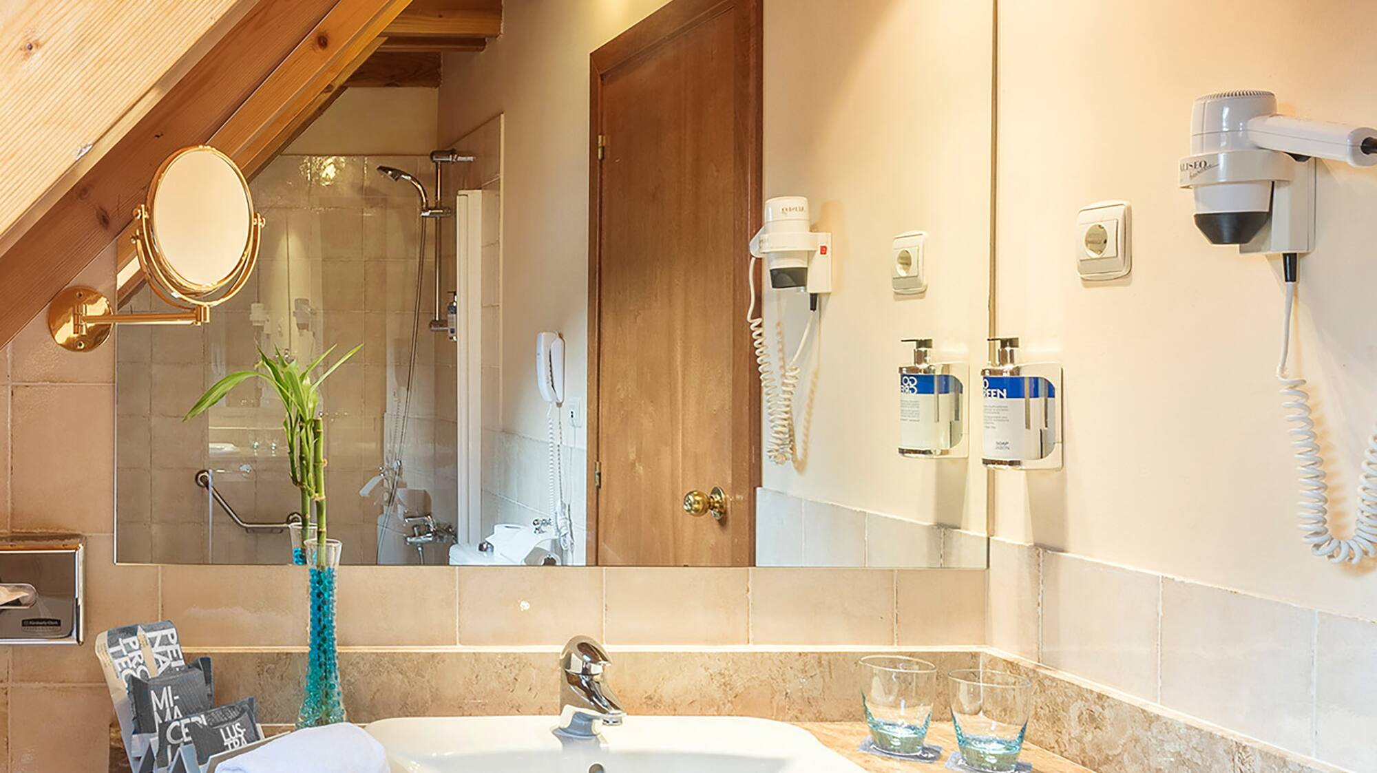a bathroom with a sink and mirror