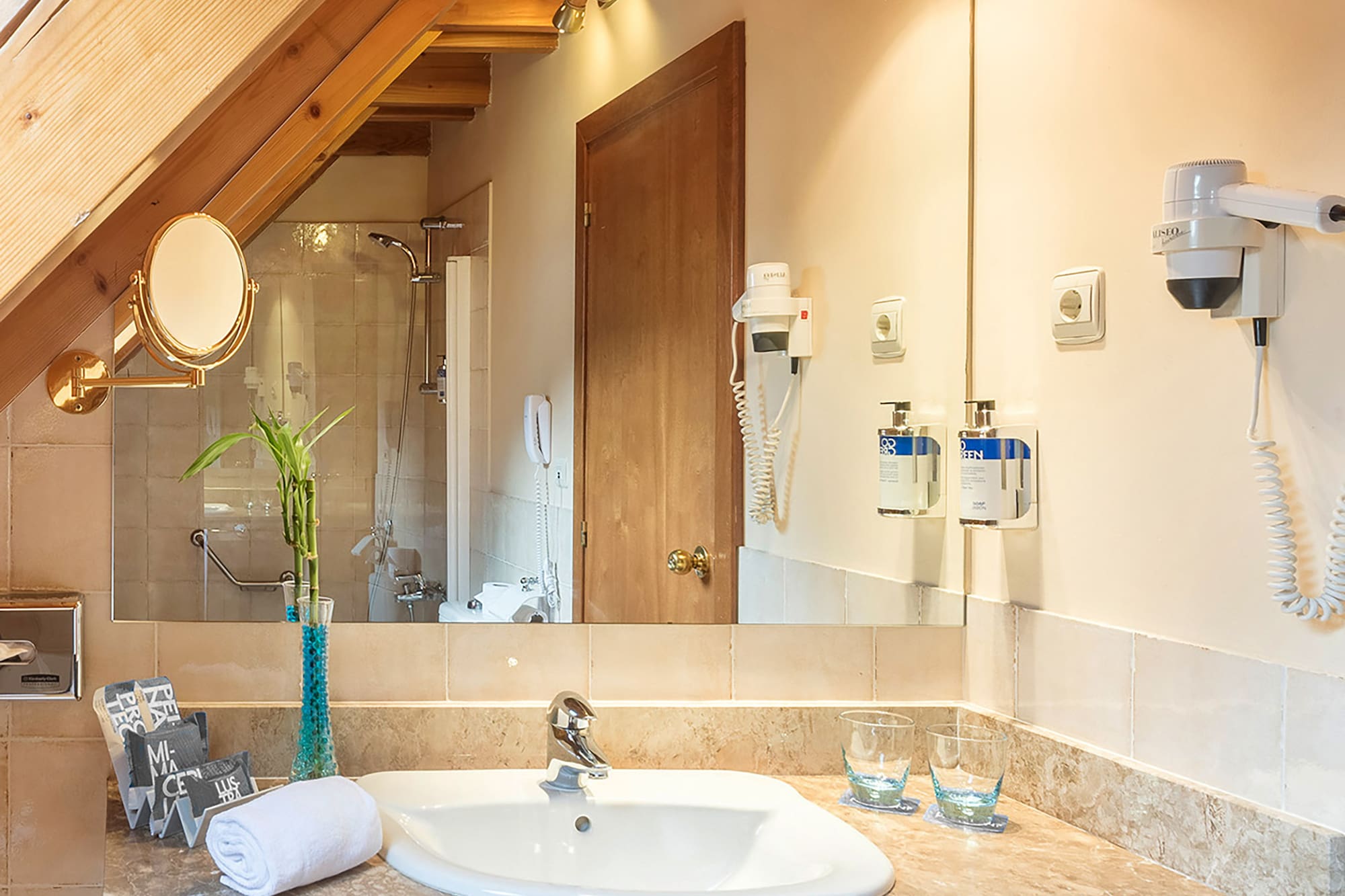 a bathroom with a sink and mirror