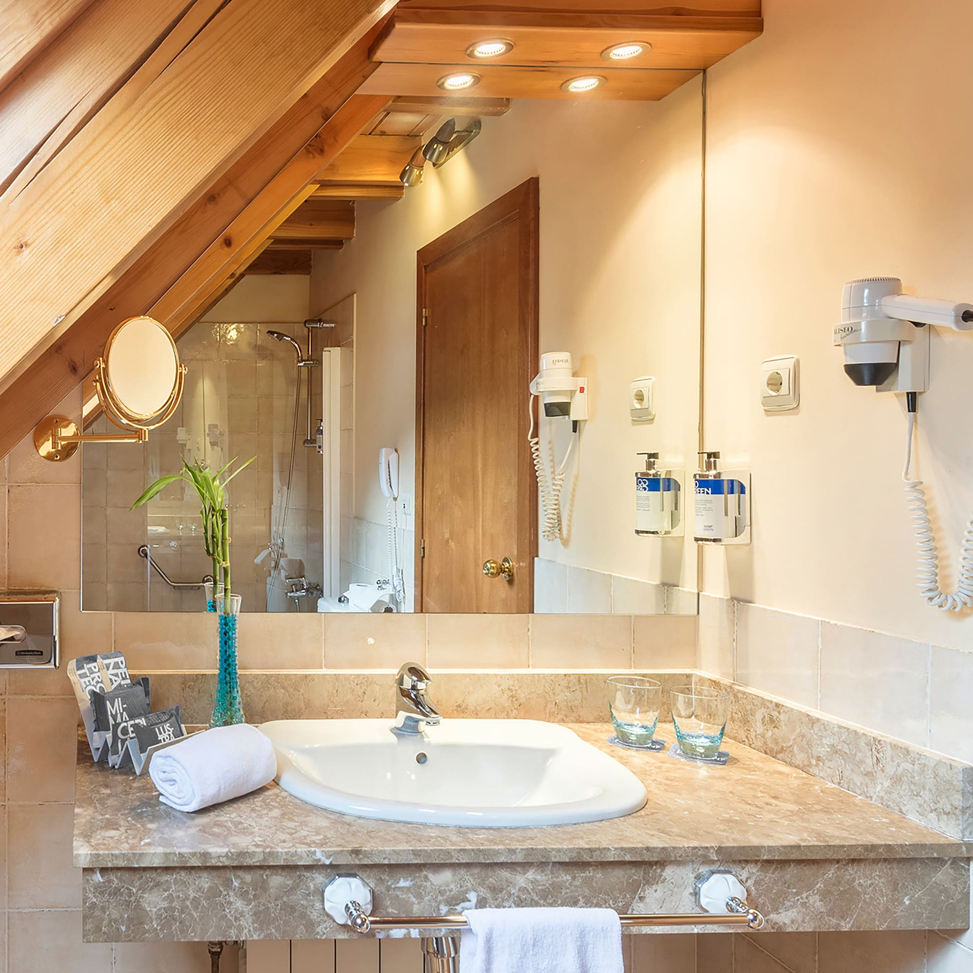 a bathroom with a sink and mirror
