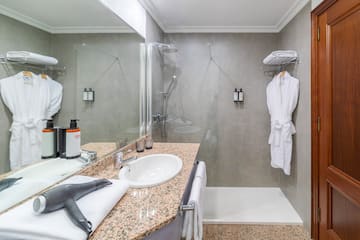 a bathroom with a shower and a sink