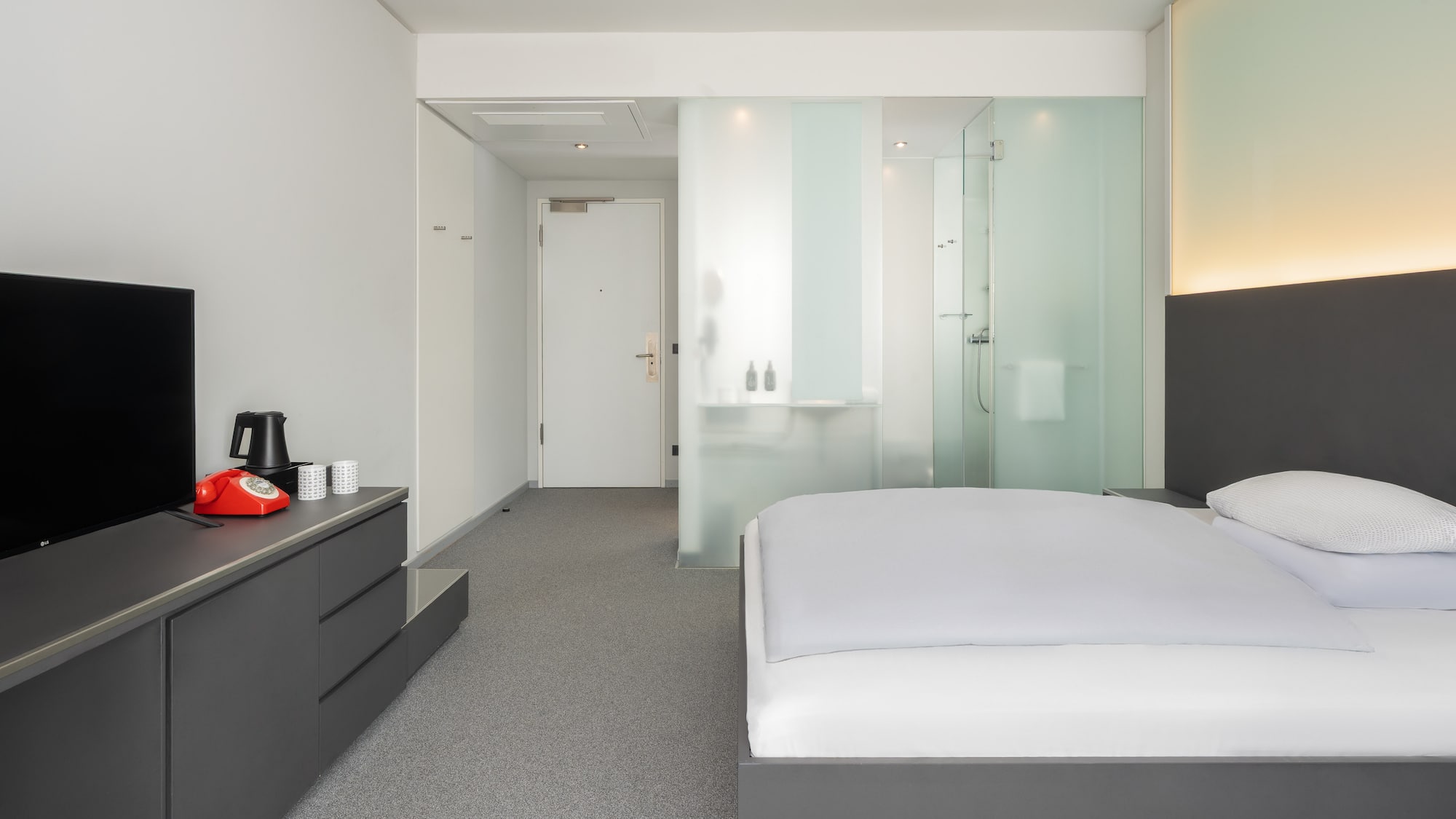 a bedroom with a bed and a shower