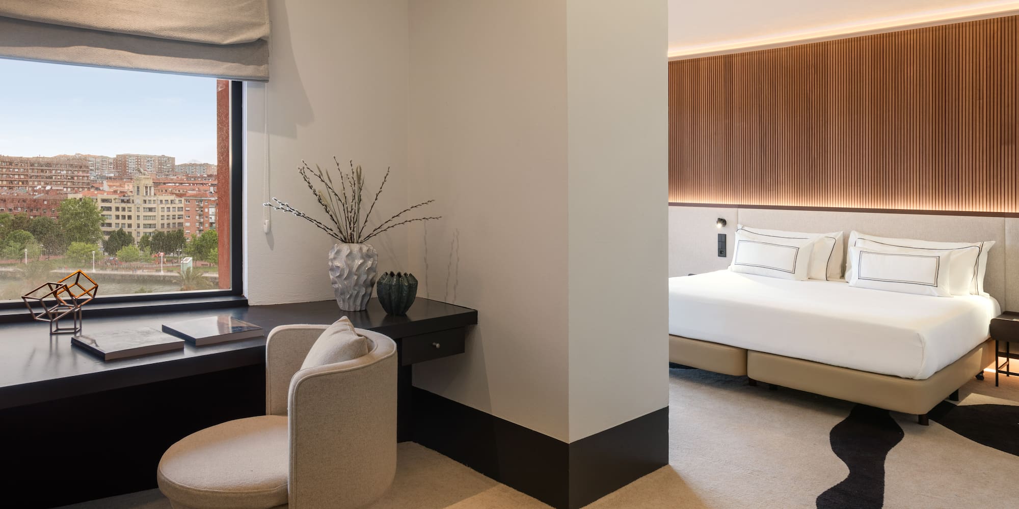 a room with a desk and a bed