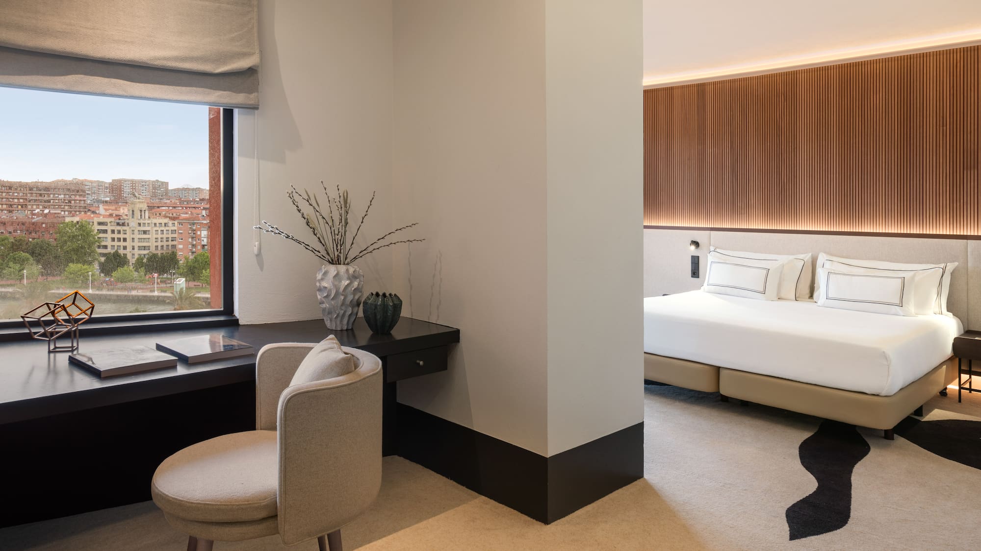 a room with a desk and a bed