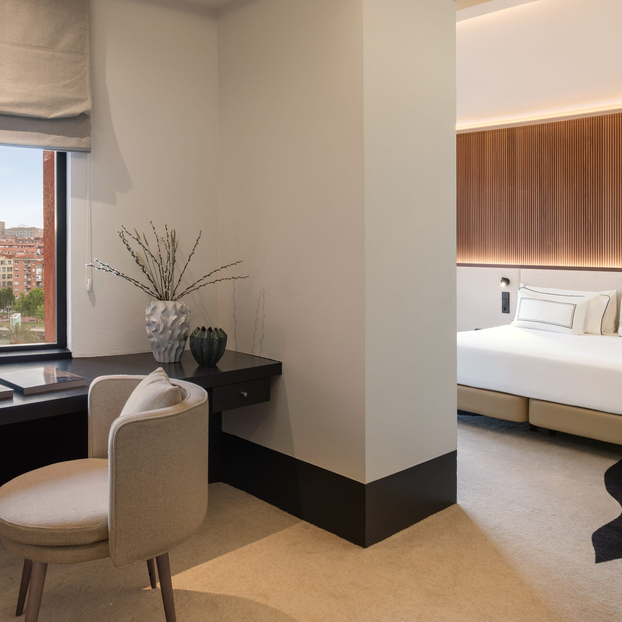 a room with a desk and a bed