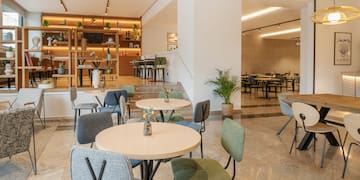 a room with tables and chairs