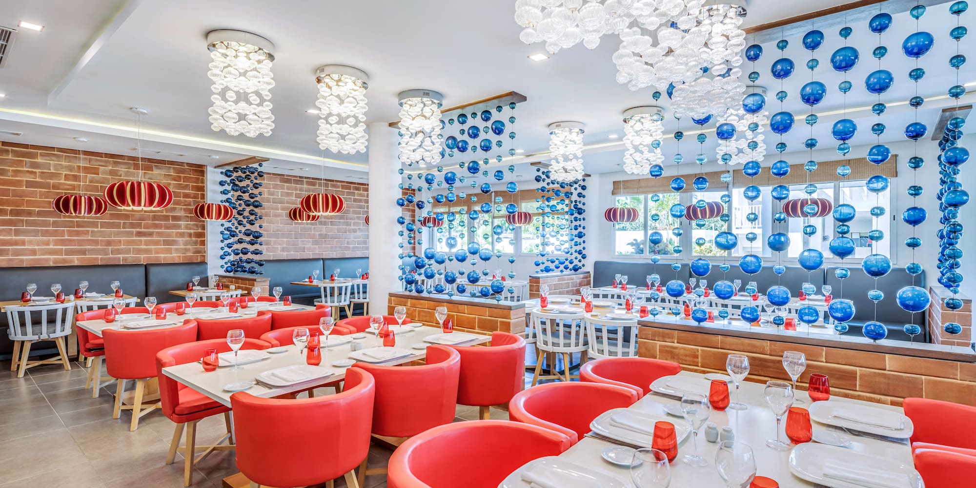 a room with red chairs and tables