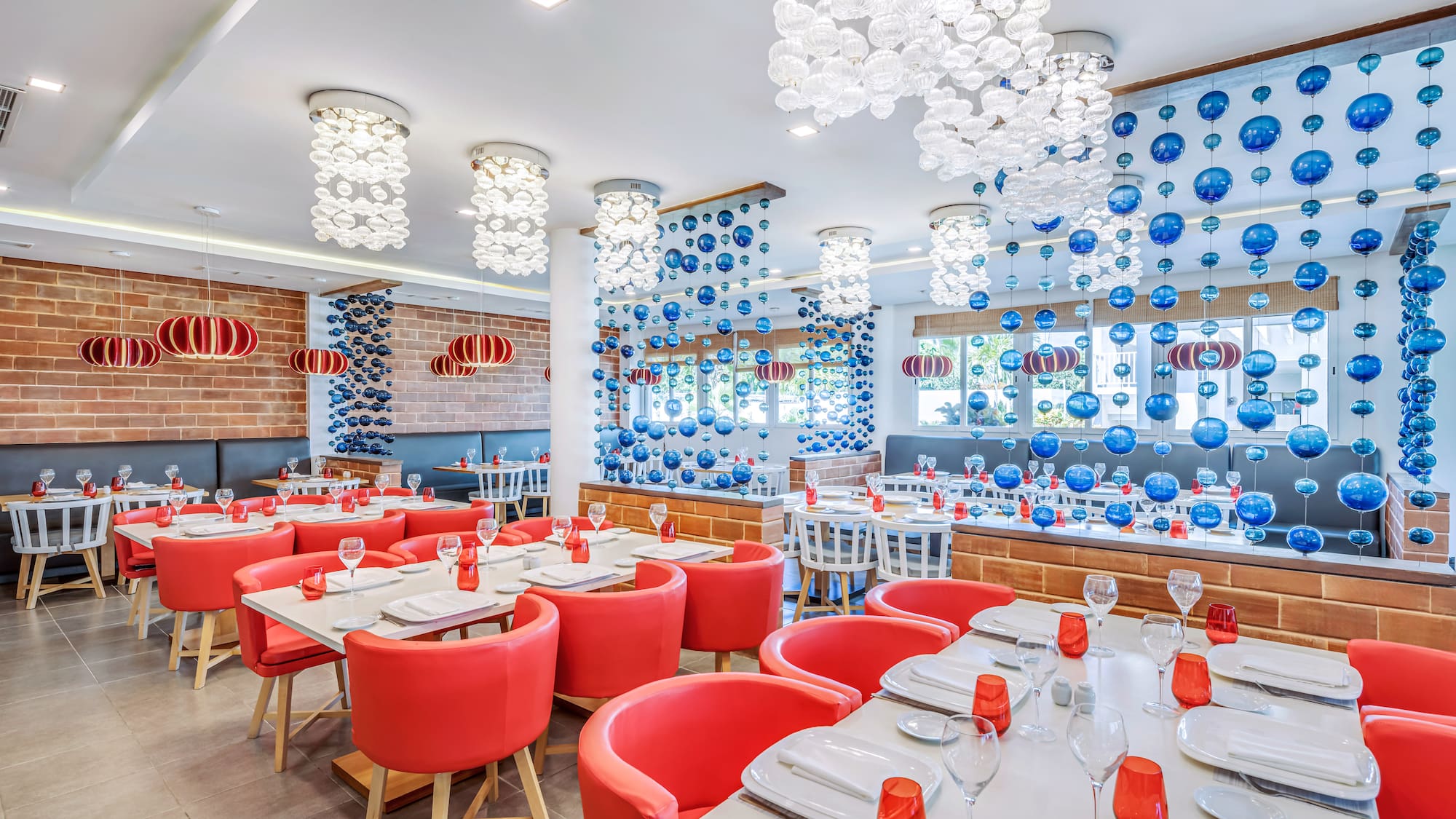 a room with red chairs and tables