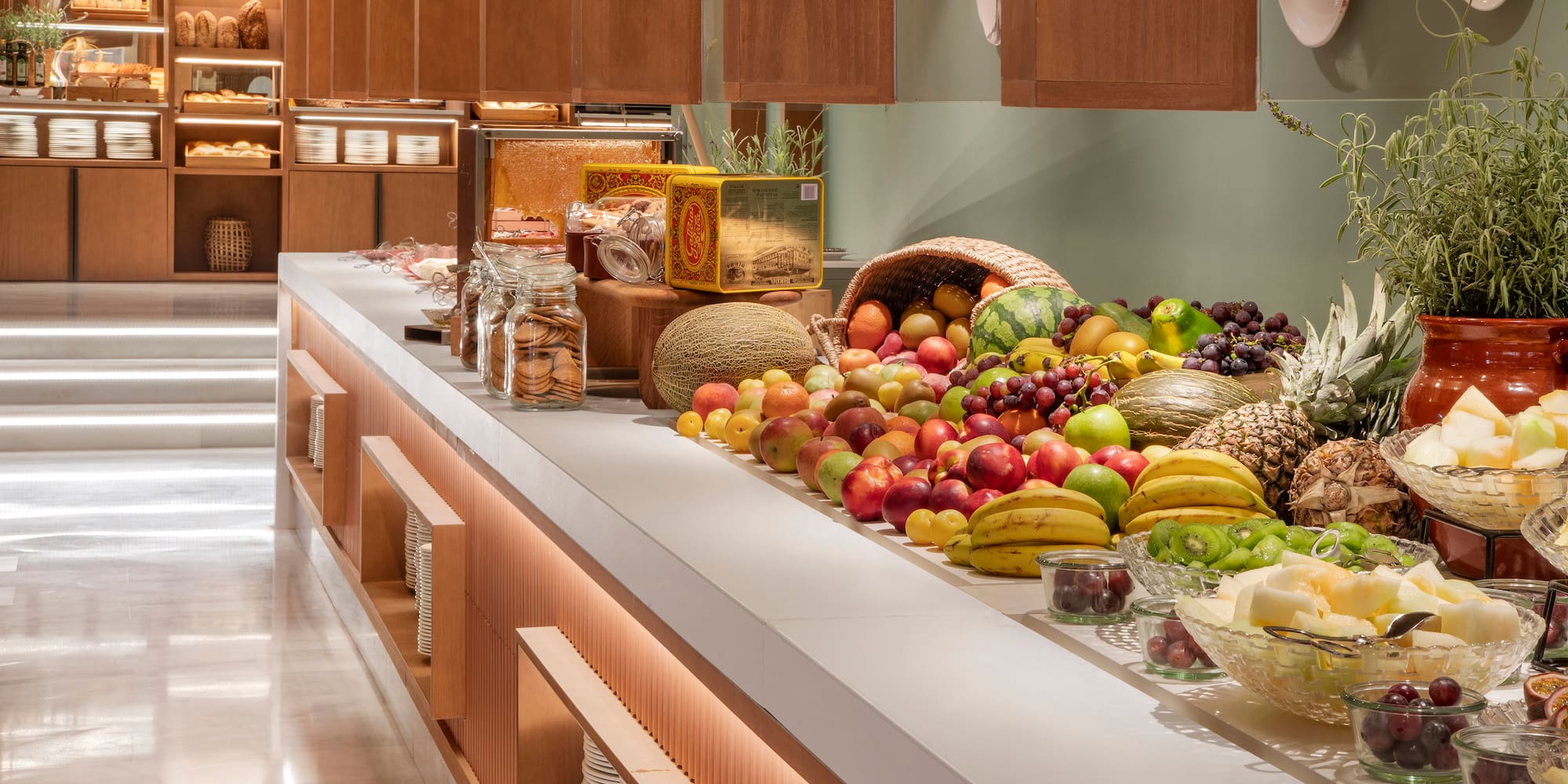 a counter with fruits and vegetables
