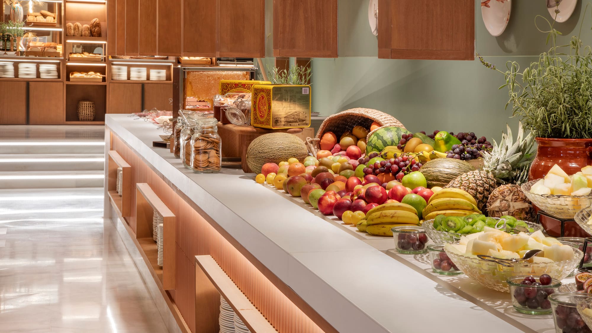 a counter with fruits and vegetables