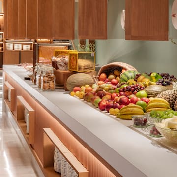 a counter with fruits and vegetables