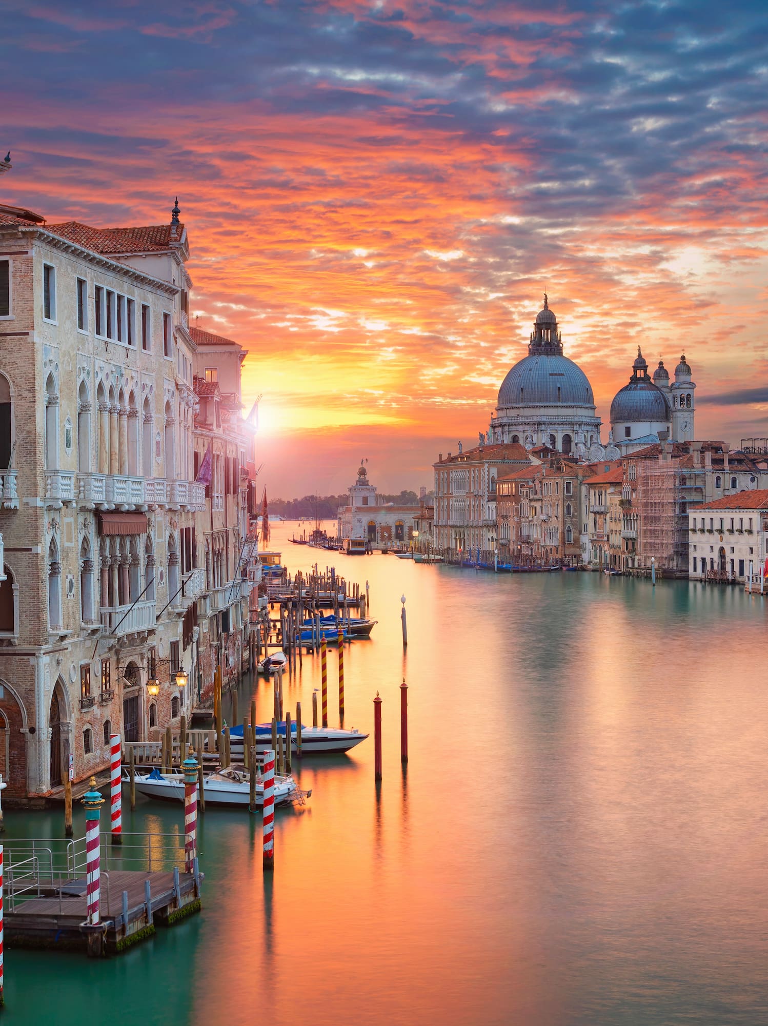 a water way with buildings and boats in it