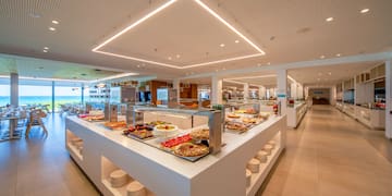 a buffet line with food on the counter