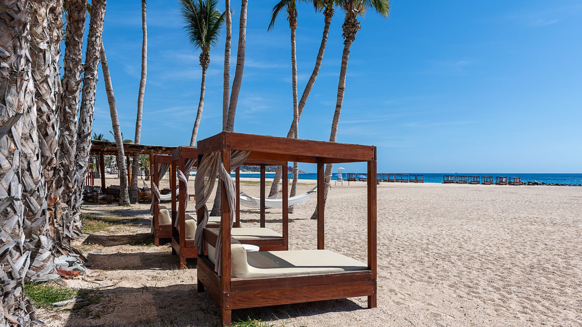 a group of beds on a beach