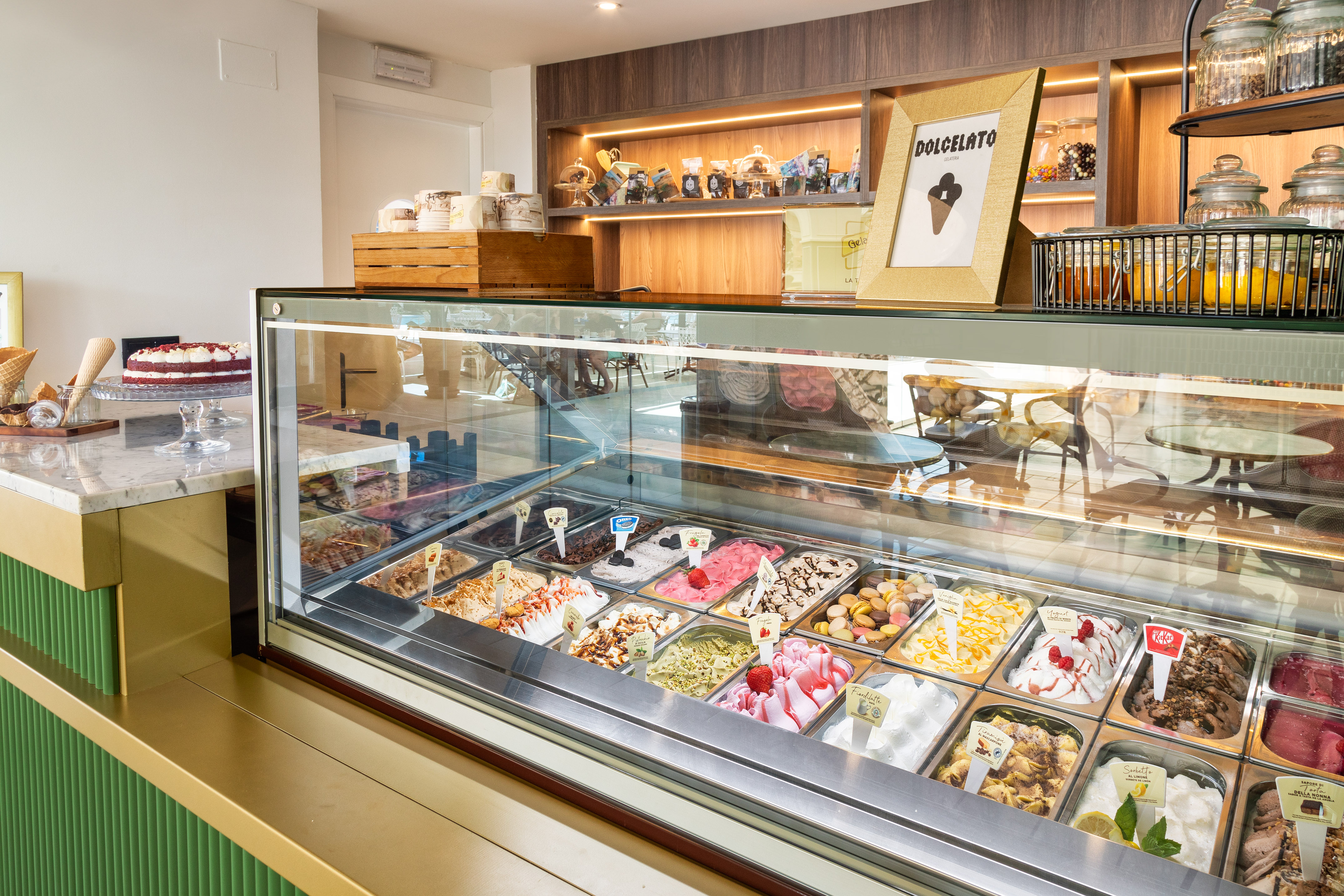 Colorful gelato flavors in a bright display case at a modern gelateria.