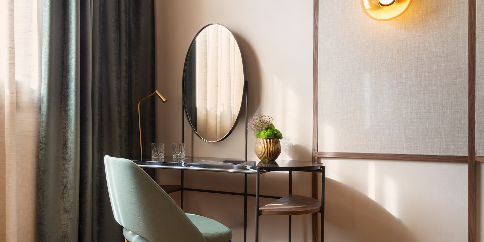 a desk with a chair and a mirror